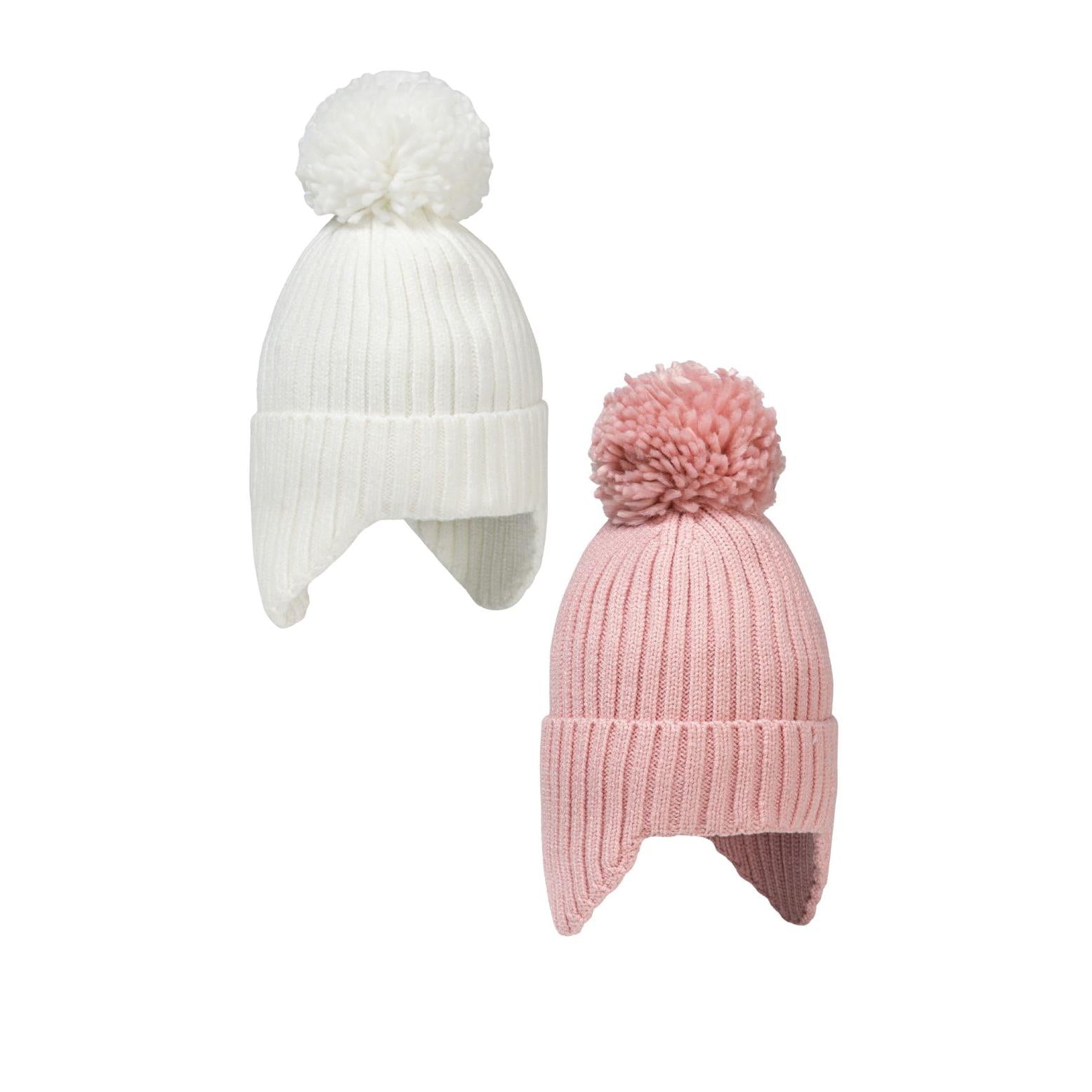 Two ribbed knit baby beanies with pom poms - one cream white and one dusty pink - displayed against white background showing ear flap design
