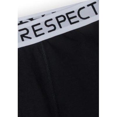 Close-up detail of white elastic waistband showing black Respect logo text with visible stitching on black fabric