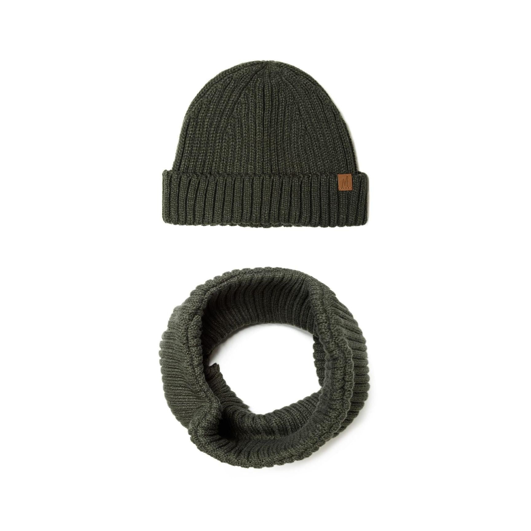 Close-up detail of khaki ribbed knit fabric showing texture and brown leather Minoti label patch