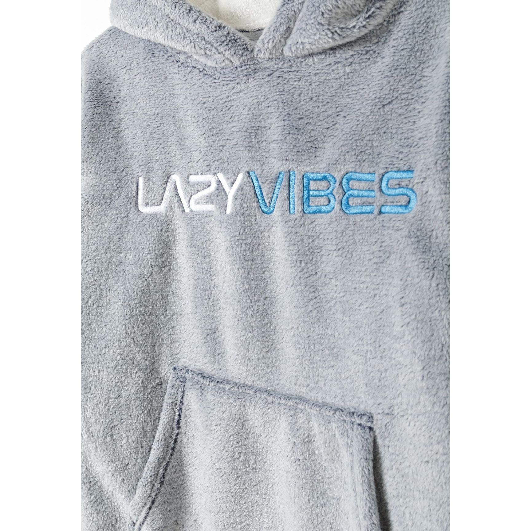 Close-up detail of LAZY VIBES embroidered text in white and blue on grey fleece fabric with kangaroo pocket visible below