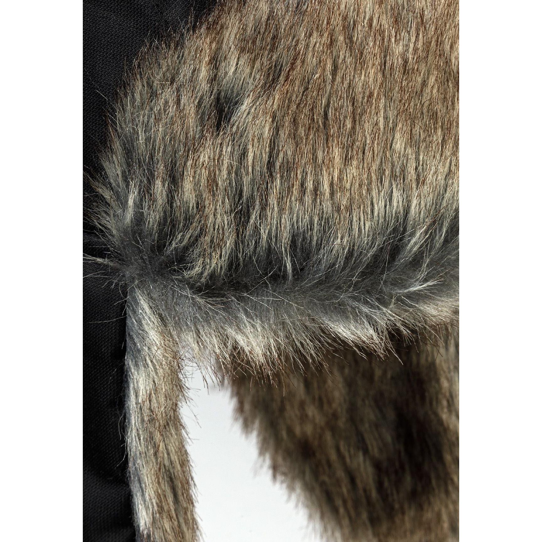 Close-up detail of brown and grey faux fur lining texture showing the soft, fluffy interior material of the trapper hat