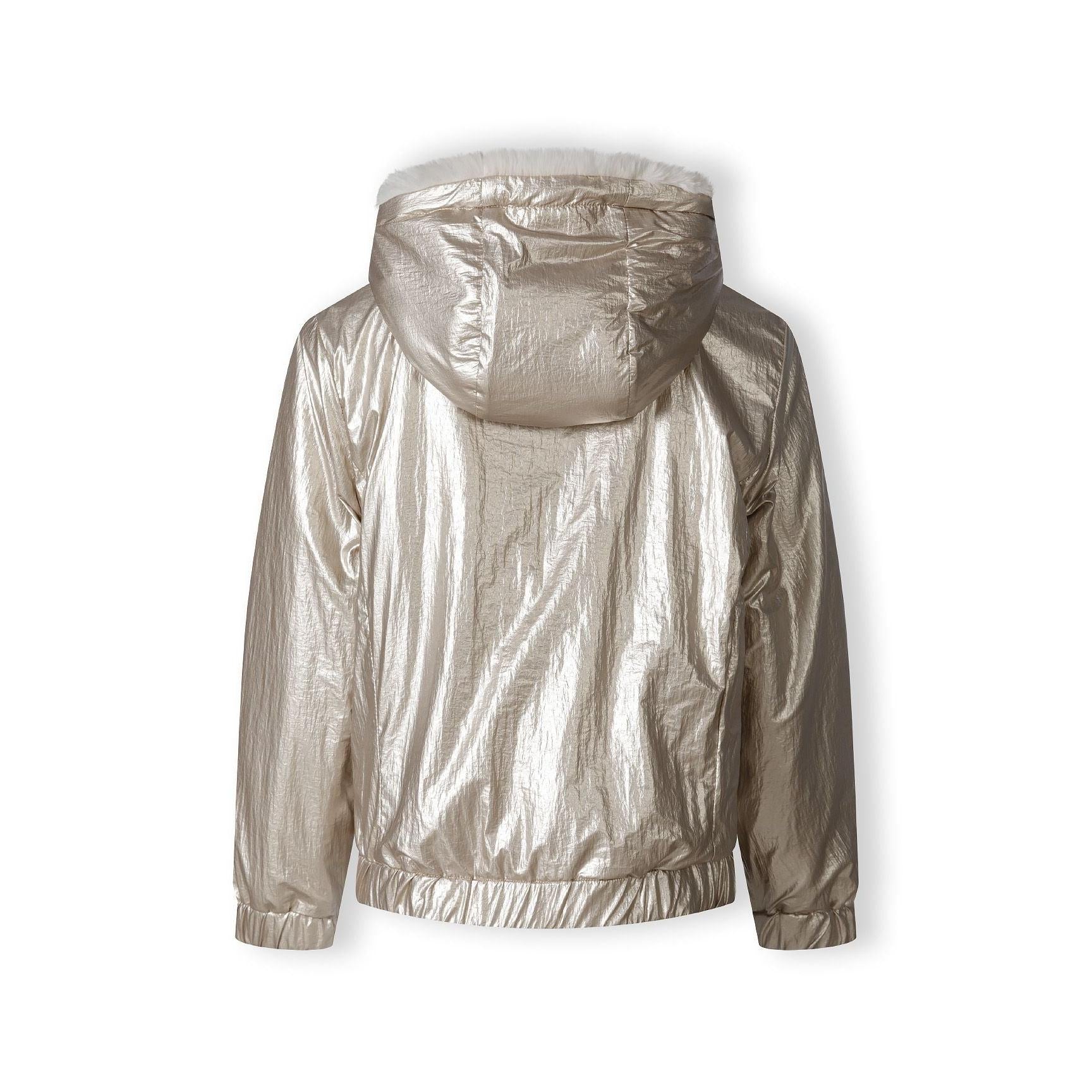 Close-up of cream teddy fur fabric texture showing soft fluffy pile and plush finish of jacket interior