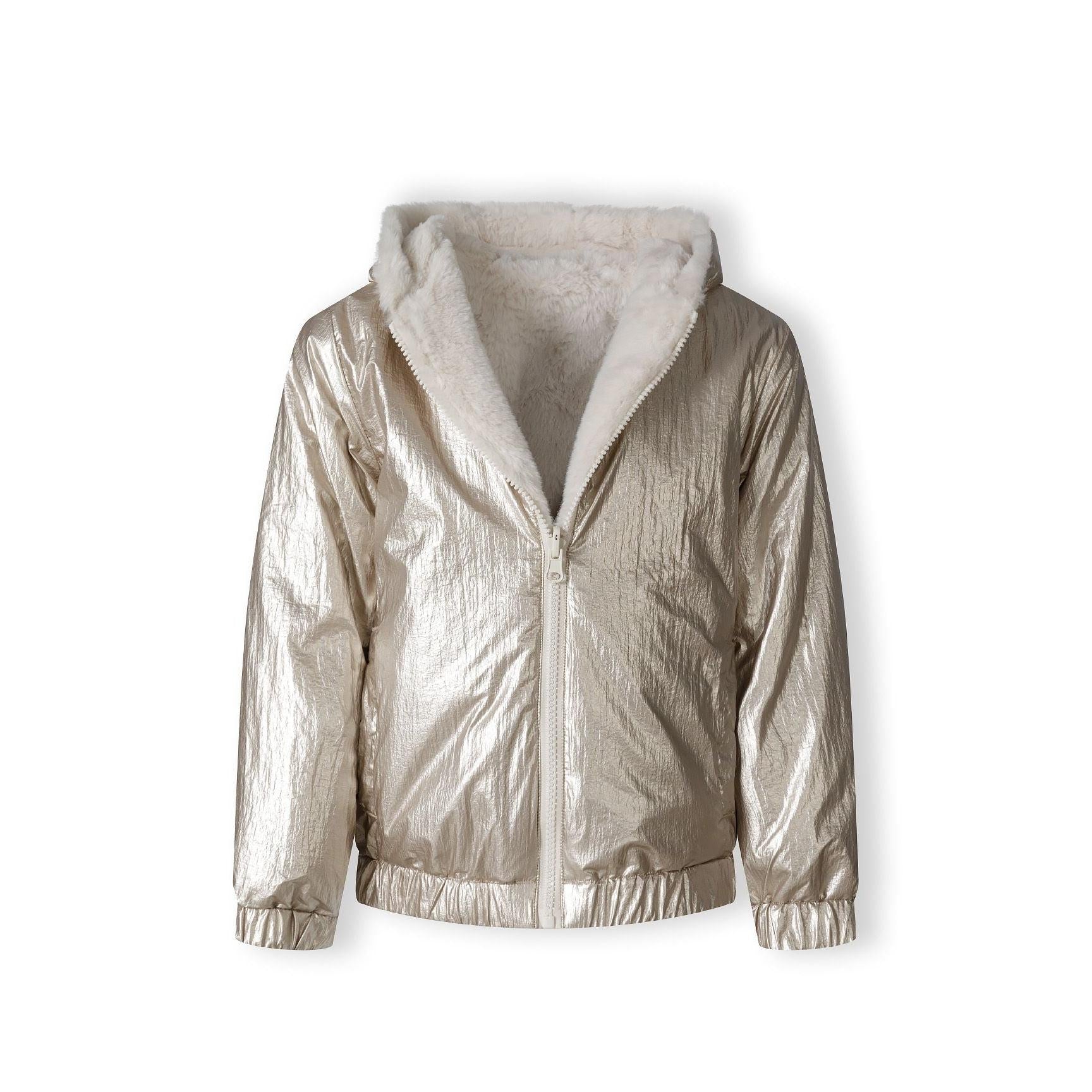 Close-up of cream teddy fur fabric texture showing soft fluffy pile and plush finish of jacket interior