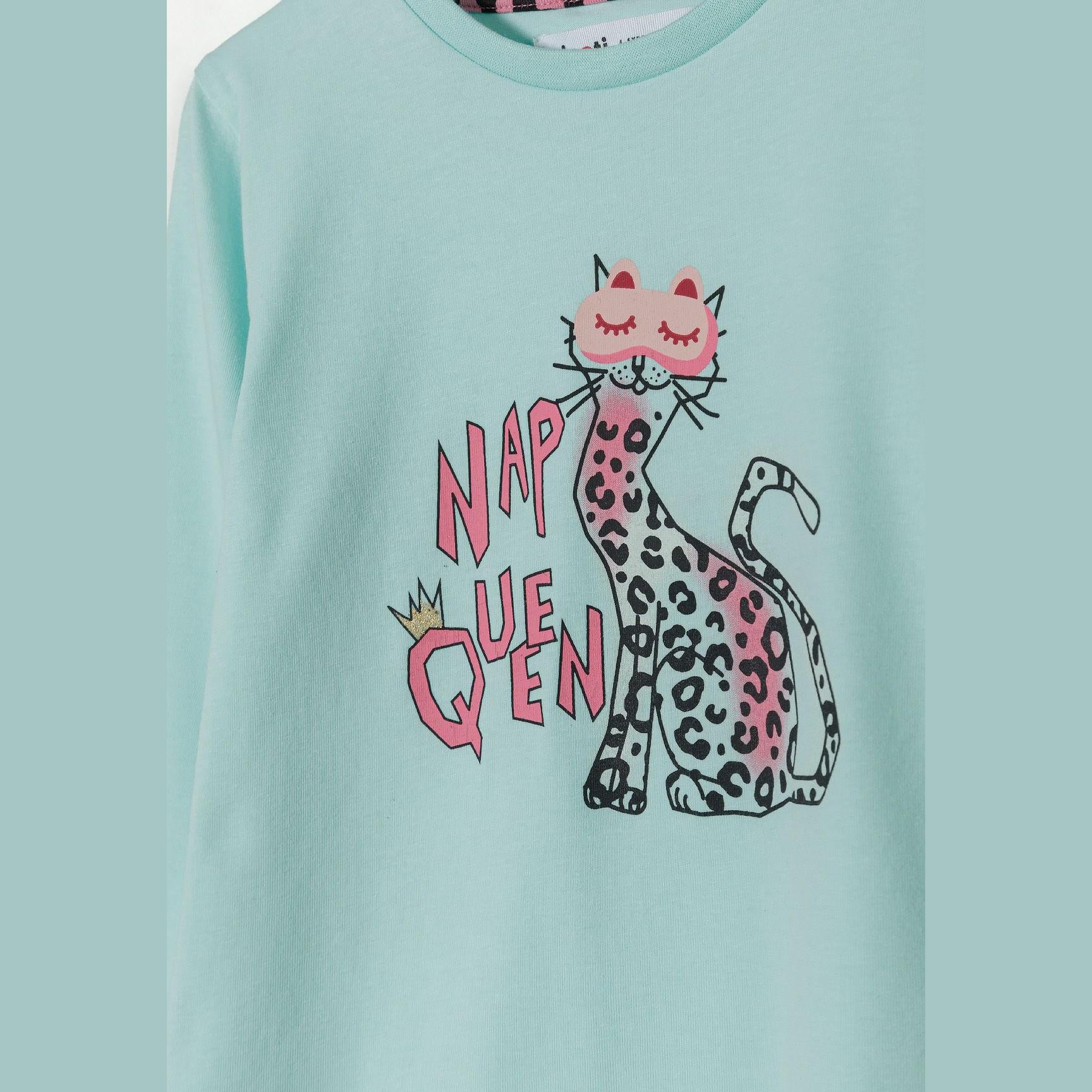 Turquoise pyjama bottoms with all-over pink cat pattern and matching turquoise ribbed cuffs laid flat on white background