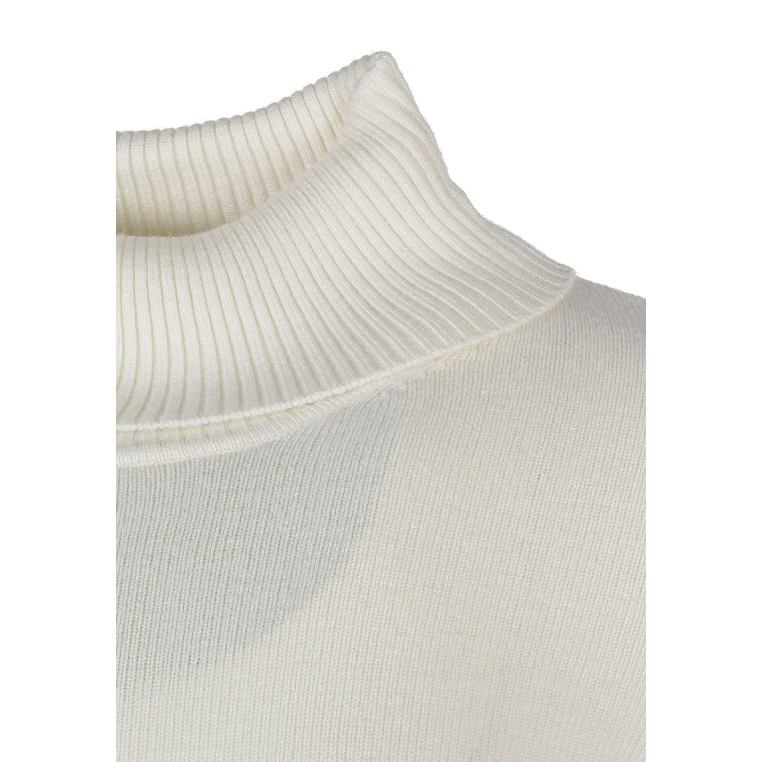 Close-up detail of cream turtleneck collar showing ribbed texture and knit construction on white background