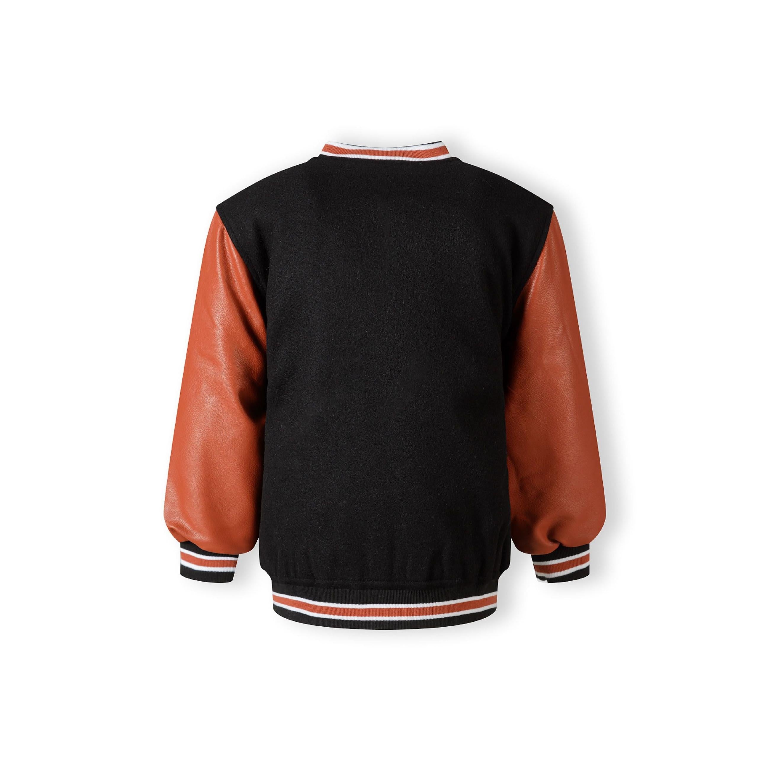 Back view of black varsity jacket showing quilted lining construction with orange PU sleeves and ribbed striped trim details on white background