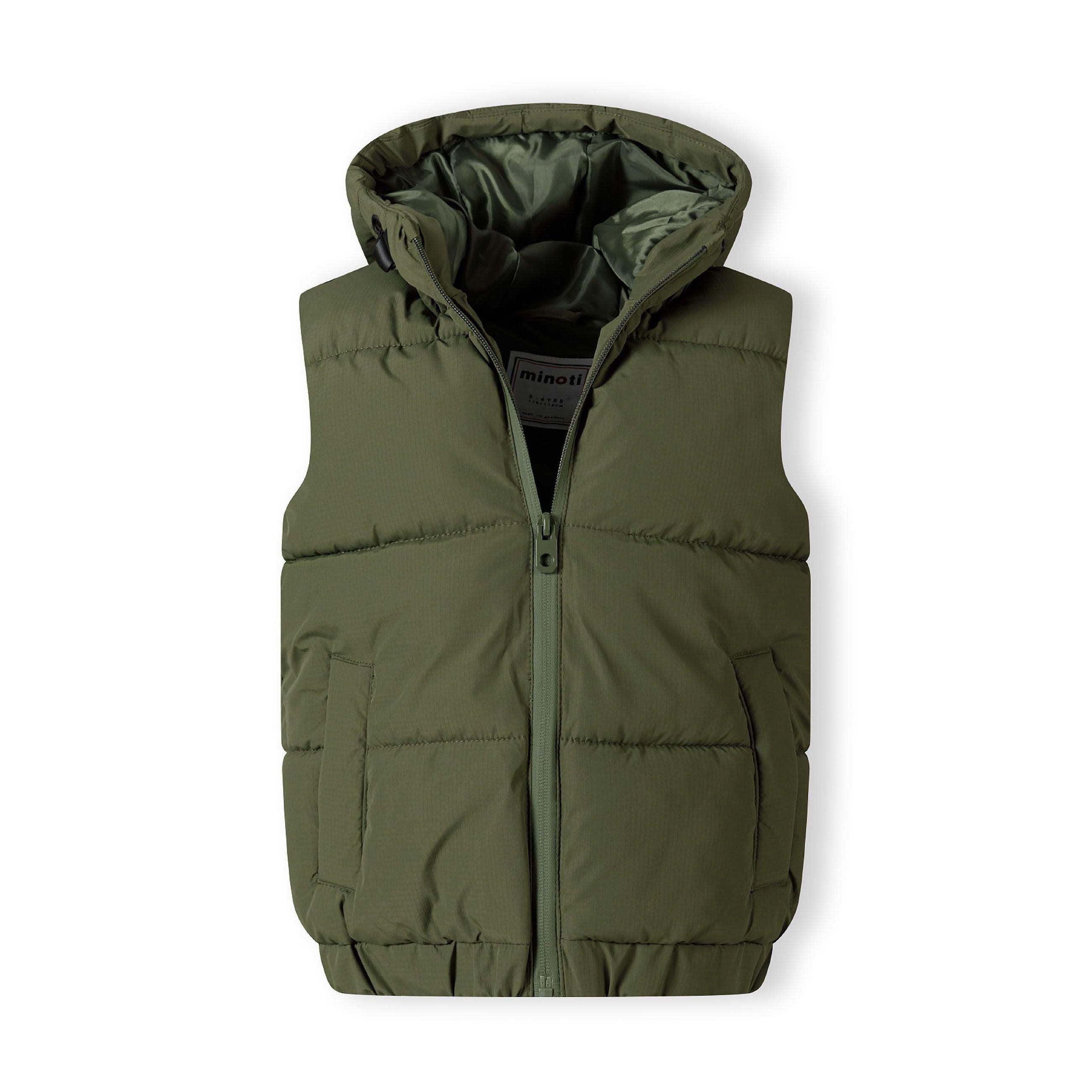 Close-up detail of khaki padded gilet showing quilted texture, stitching lines, and fabric construction