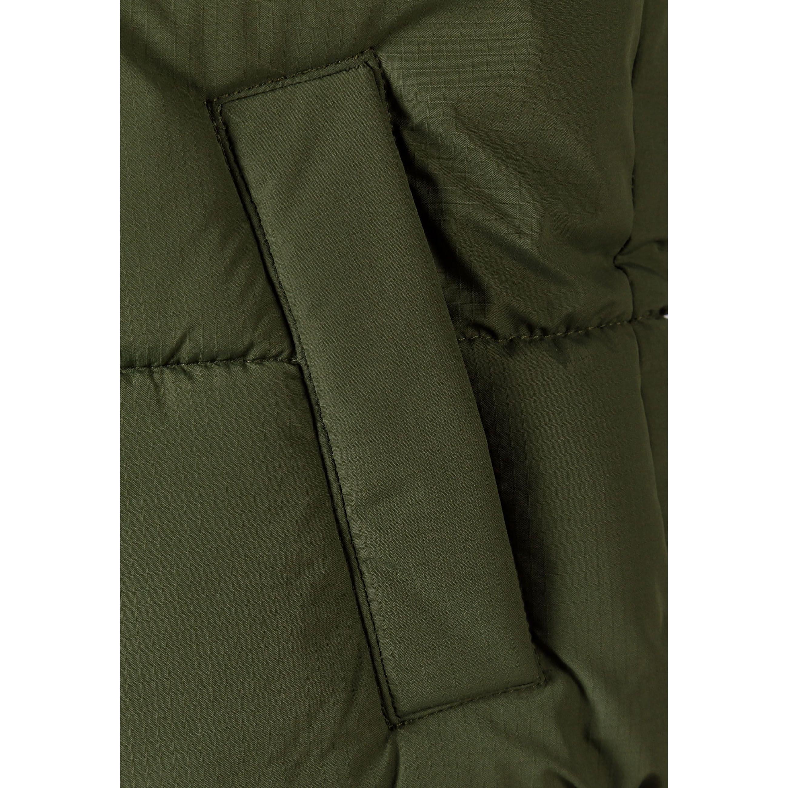 Close-up detail of khaki padded gilet showing quilted texture, stitching lines, and fabric construction