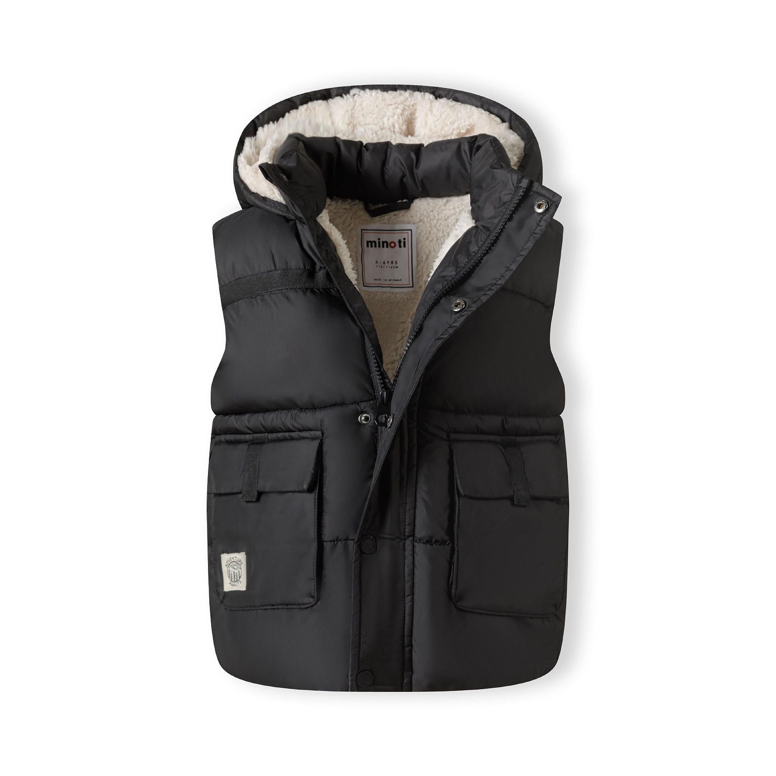 Front view of black hooded gilet opened to show cream teddy fleece lining and Minoti label inside, with patch pockets visible