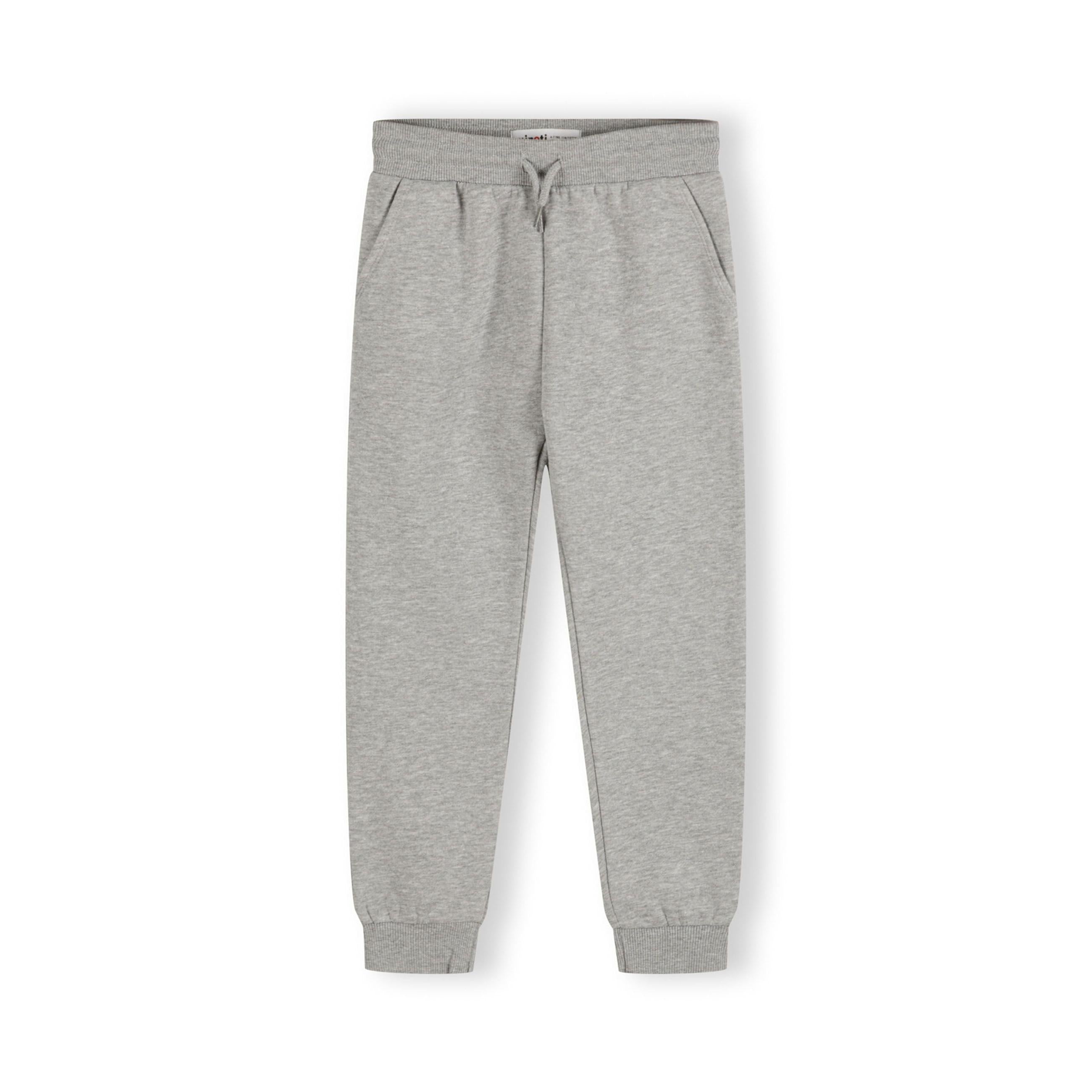 Single grey children's sweatpants laid flat showing front view with drawstring waist, side pockets and ribbed ankle cuffs against white background