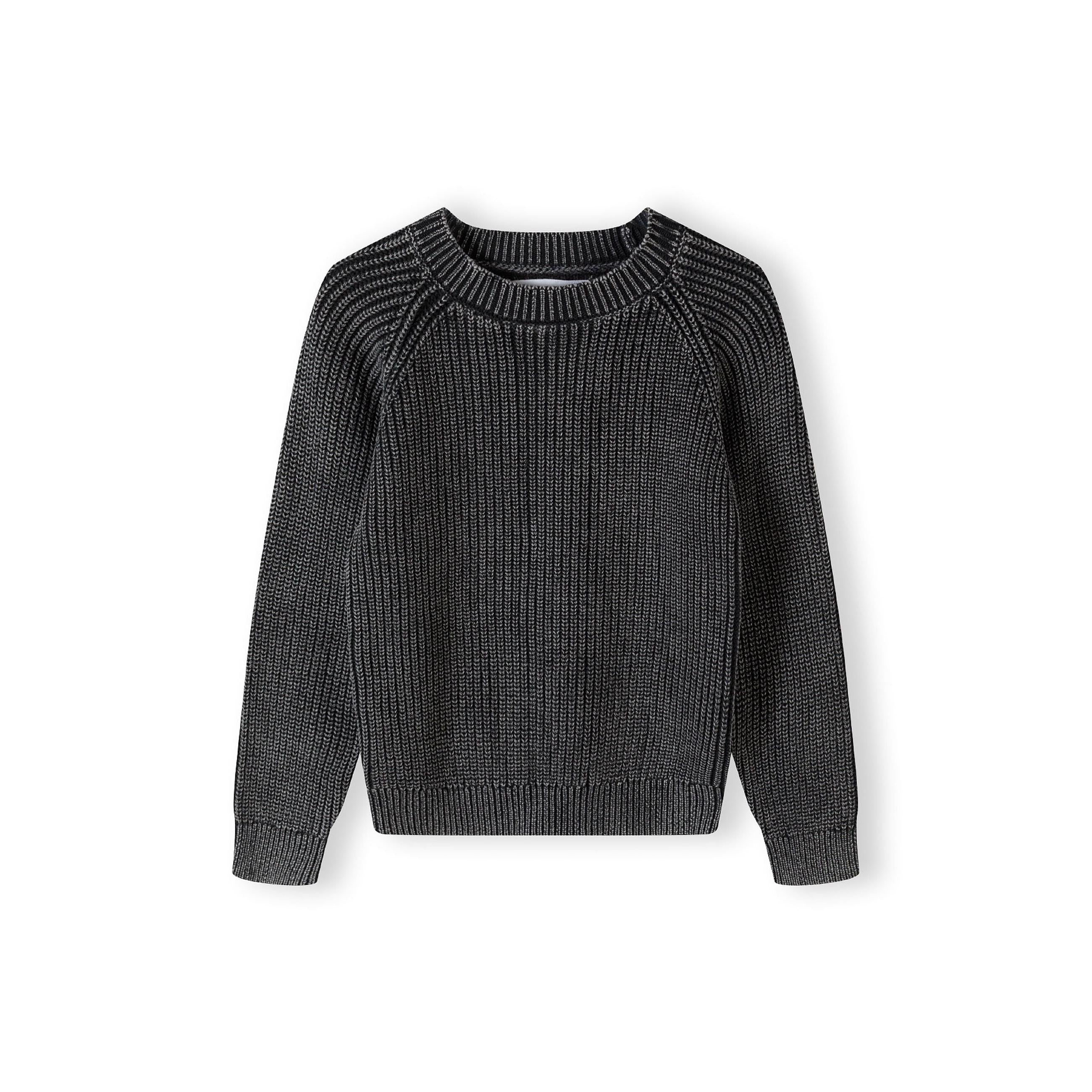 Black acid wash jumper laid flat showing raglan sleeve construction and ribbed knit texture against white background