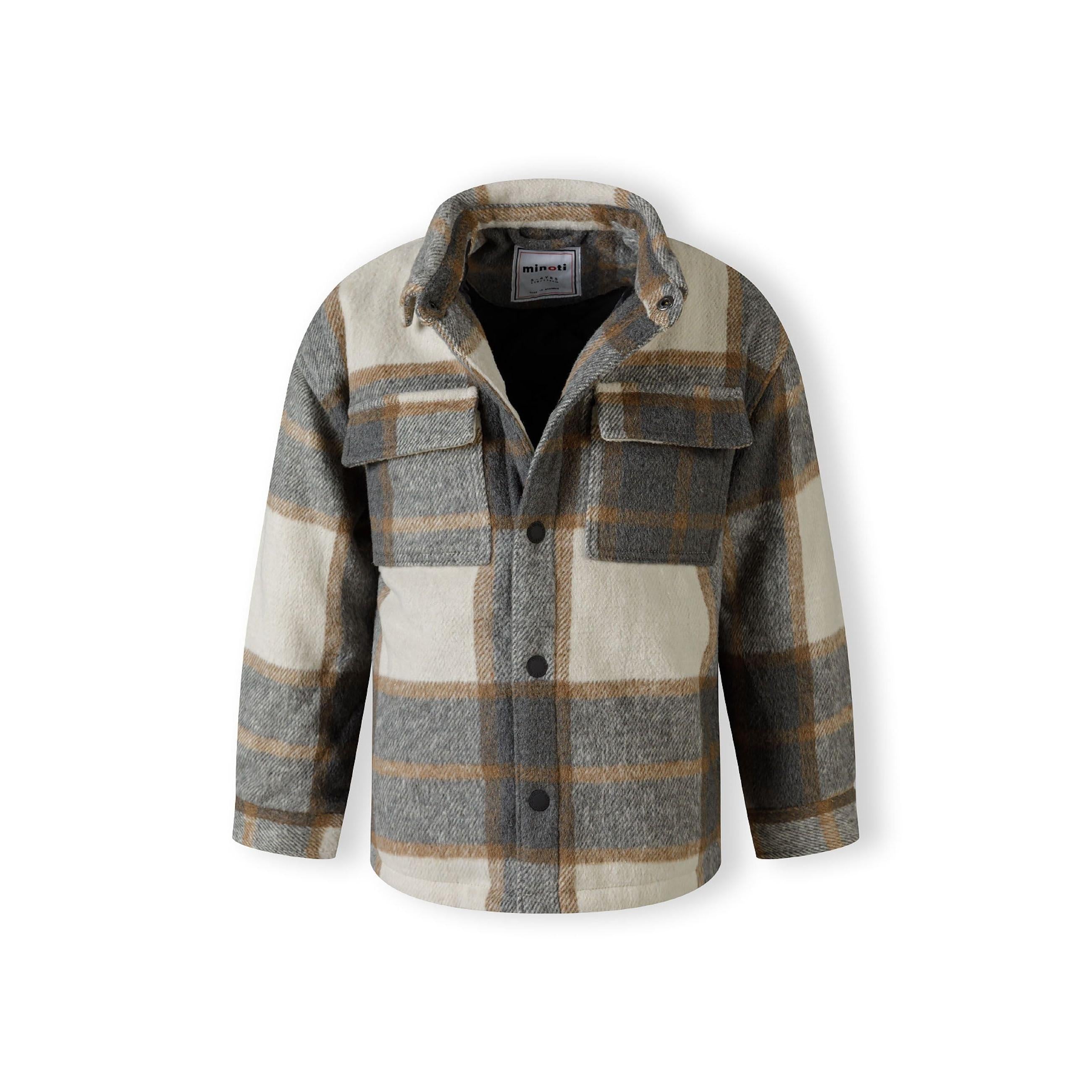 Close-up detail of grey check padded shirt jacket chest pocket with button flap closure and wool blend fabric texture