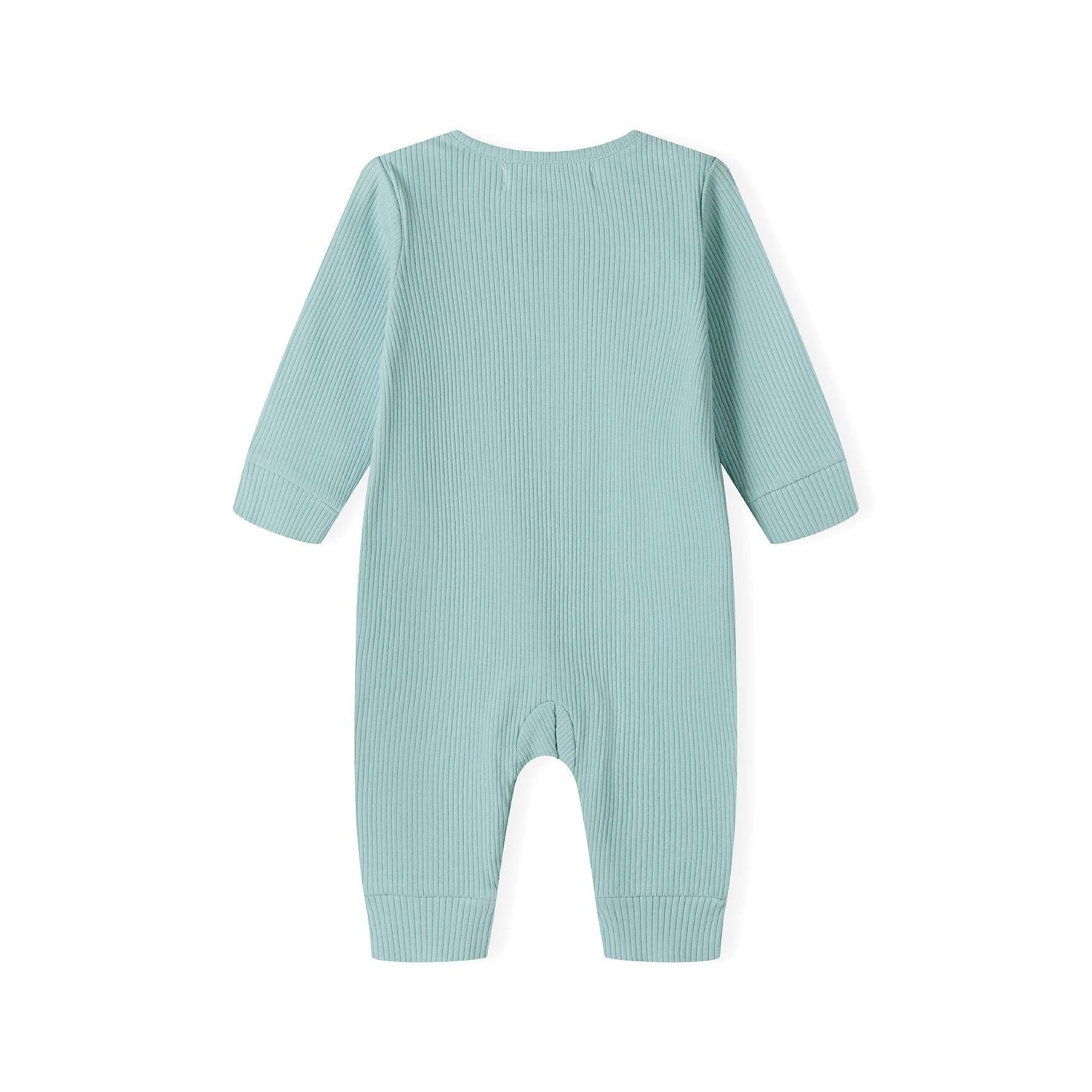 Close-up detail of sage green ribbed romper displaying Minoti brand label and front snap button closure design