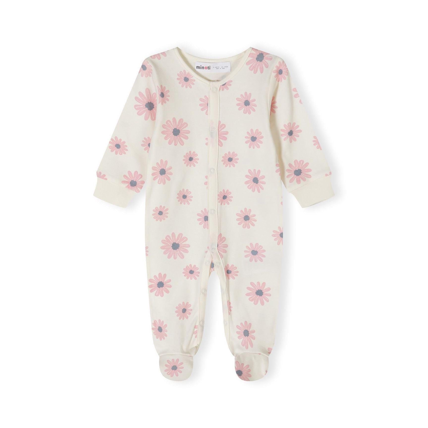 Close-up detail of pink sleepsuit with Minoti label showing white elephant motif with colorful flowers on chest area