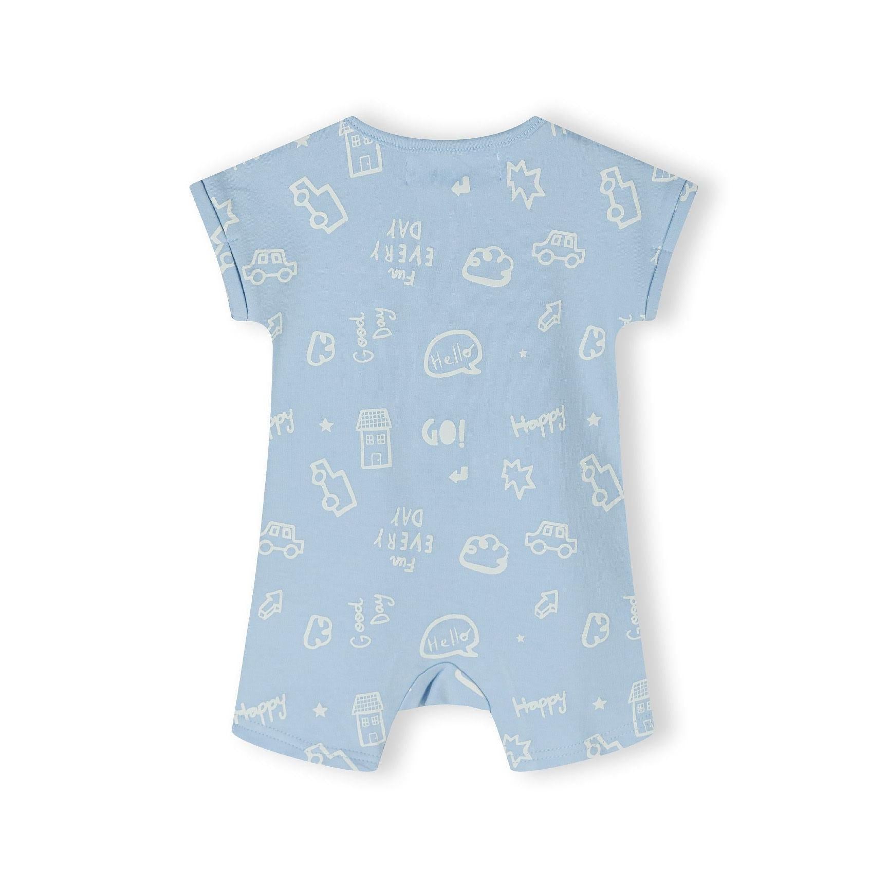 Close-up detail of light blue romper showing snap button closure and white printed design including cars, houses, stars and Hello text