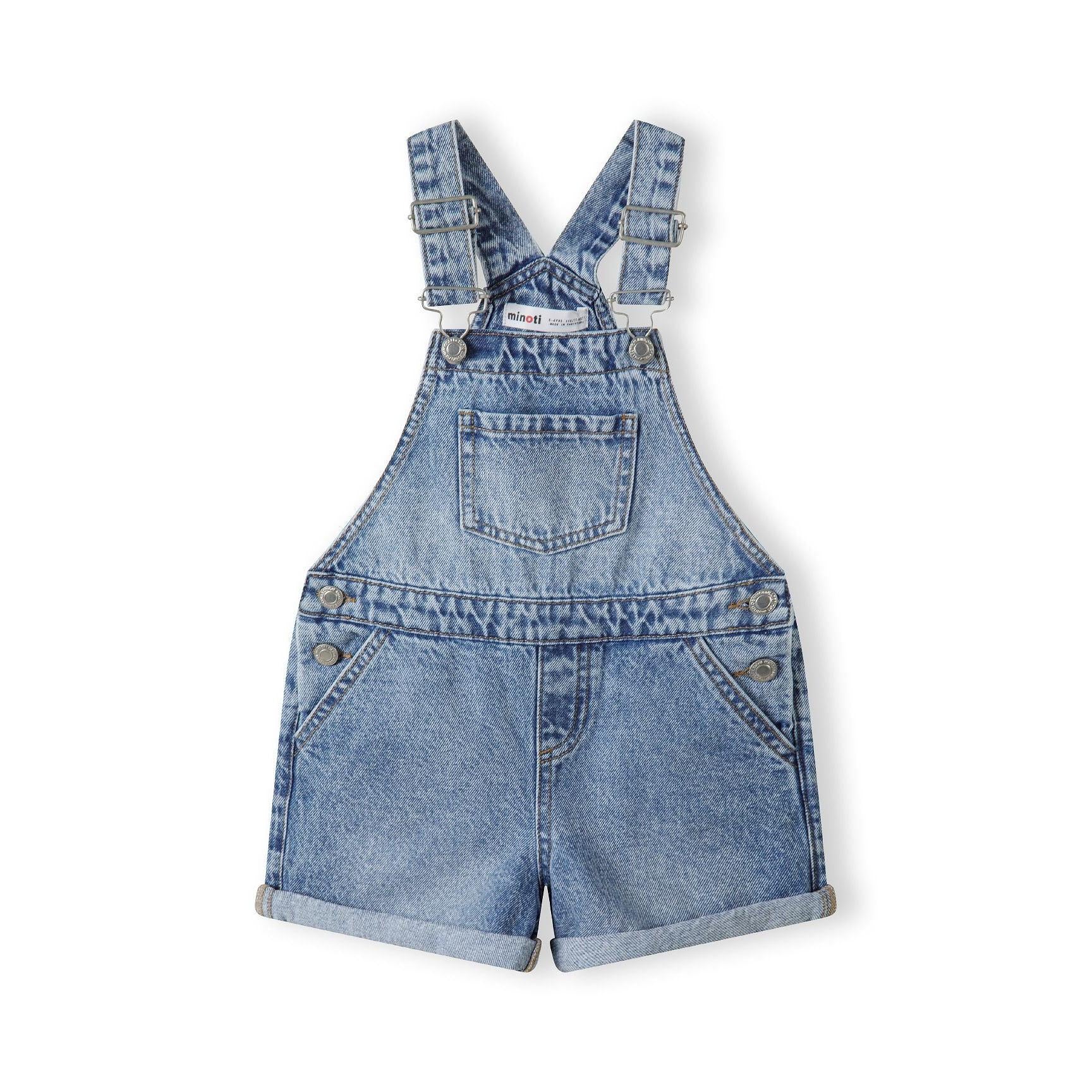 Back view of navy denim short dungarees showing adjustable braces, rear pockets and rolled hem details on white background