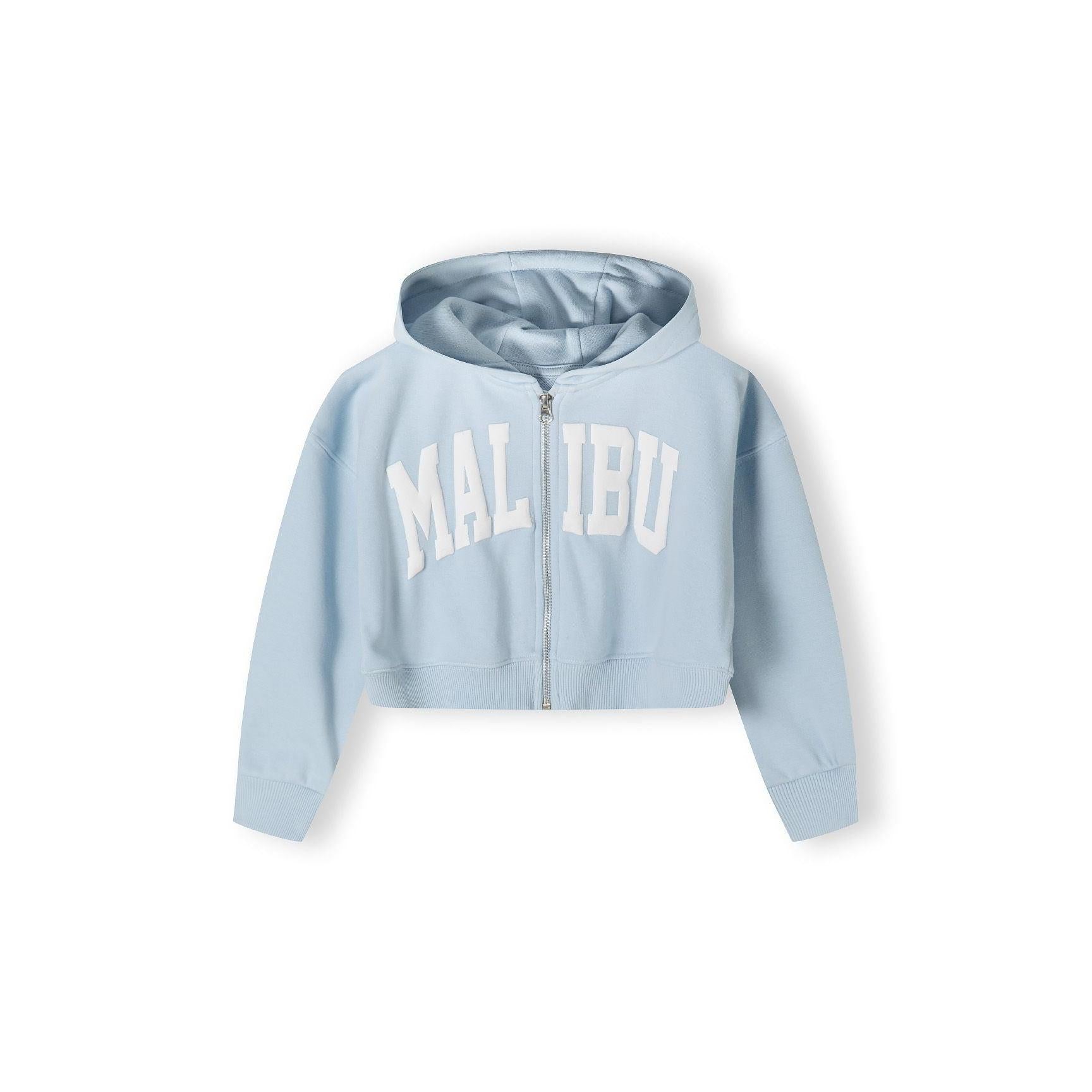 Close-up detail of light blue wide leg joggers showing elastic waistband with drawstring and white USA 1967 text print