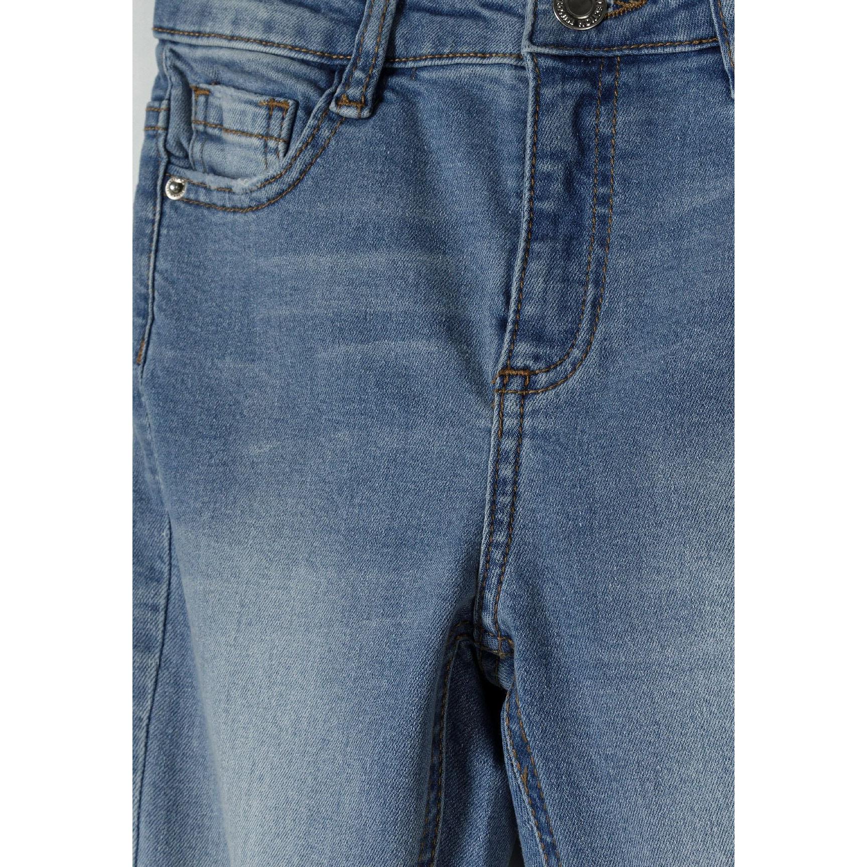 Close-up detail of navy denim jeans showing front waistband area with button closure and front pockets