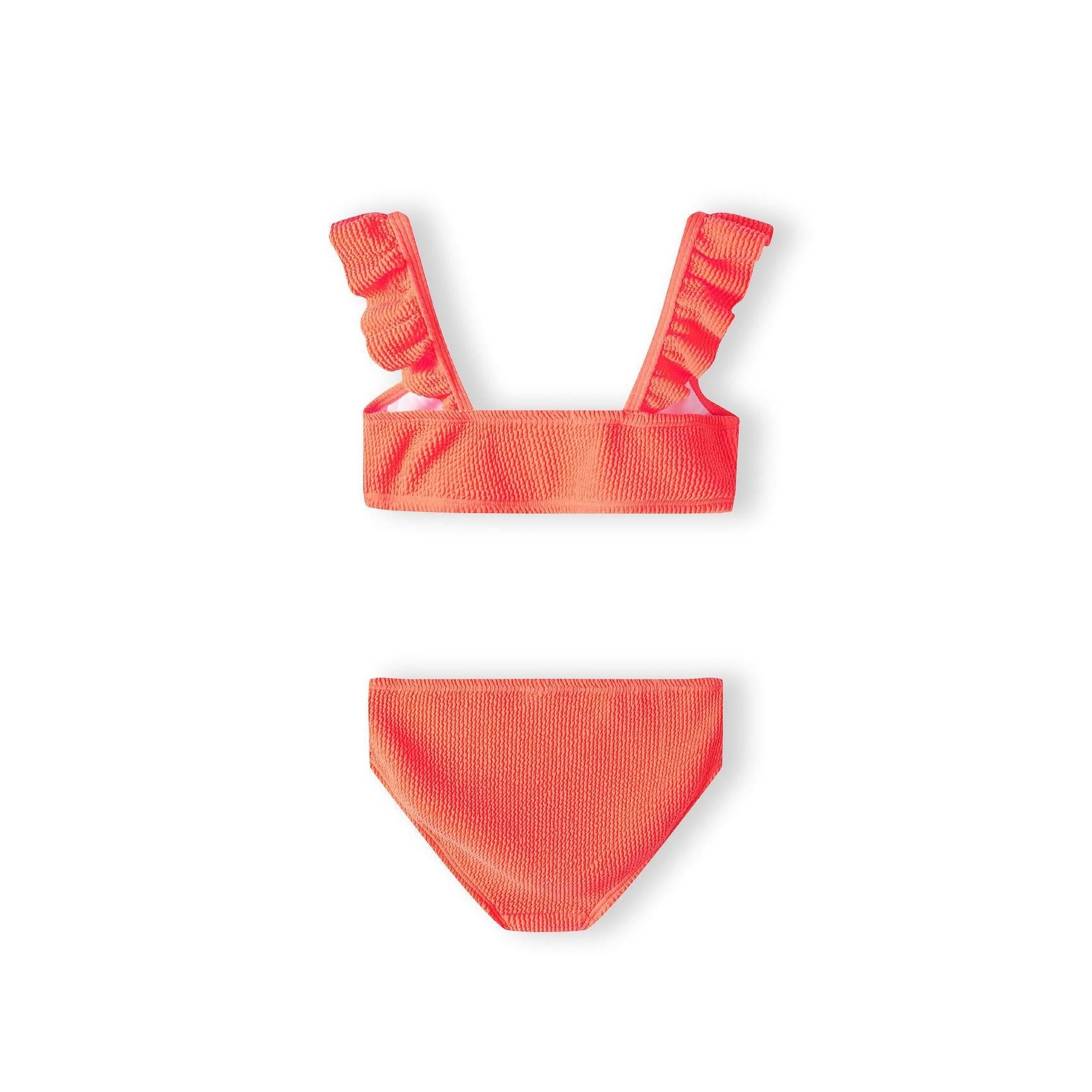 Close-up view of orange bikini top with textured quick-dry fabric and decorative ruffle shoulder straps on white background