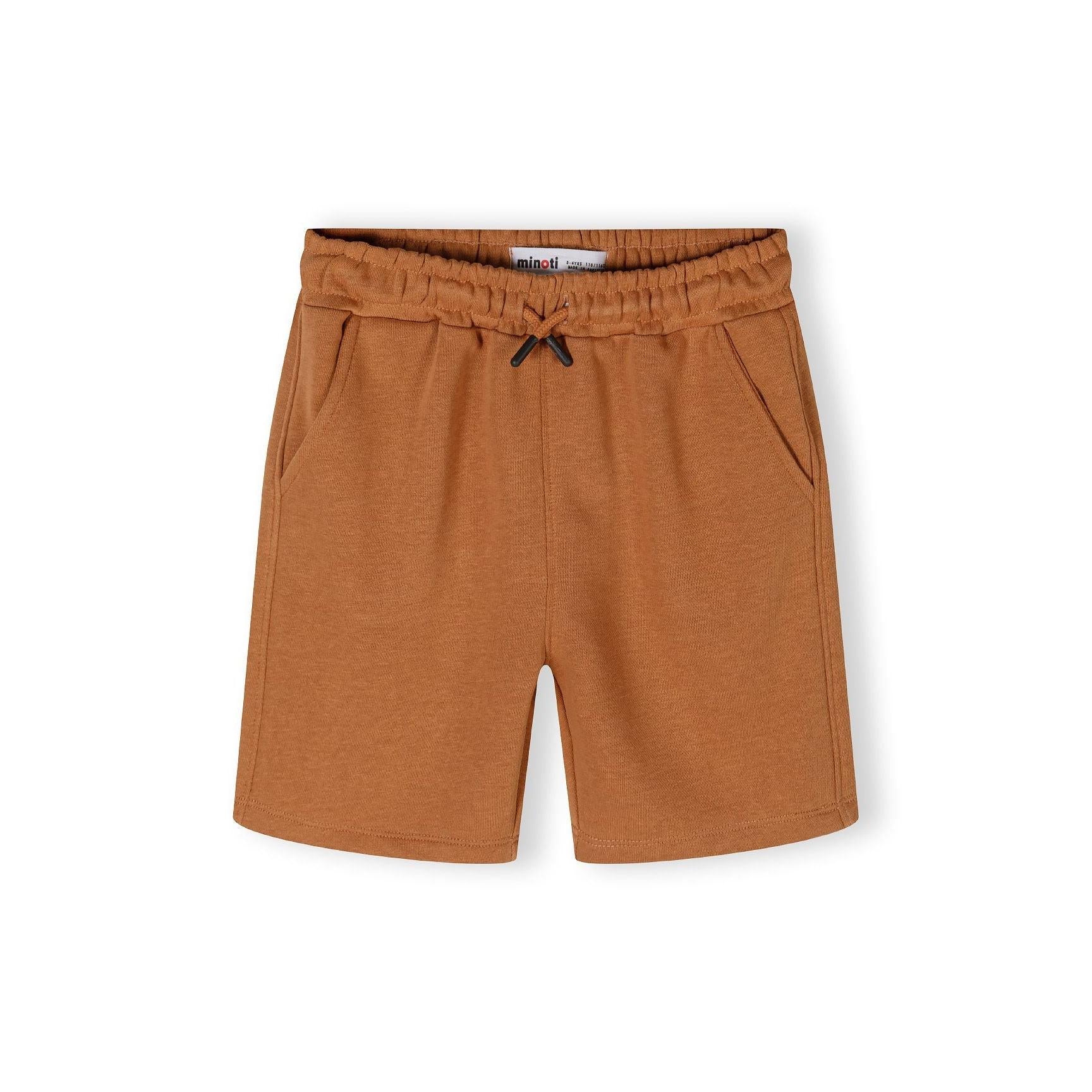 Close-up detail of camel brown shorts showing elasticated waistband with drawstring ties and soft jersey texture