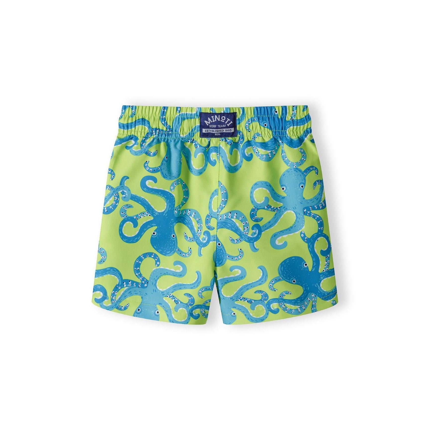 Back view of the same lime green octopus print board shorts showing Minoti brand label at waistband, displayed flat against white background