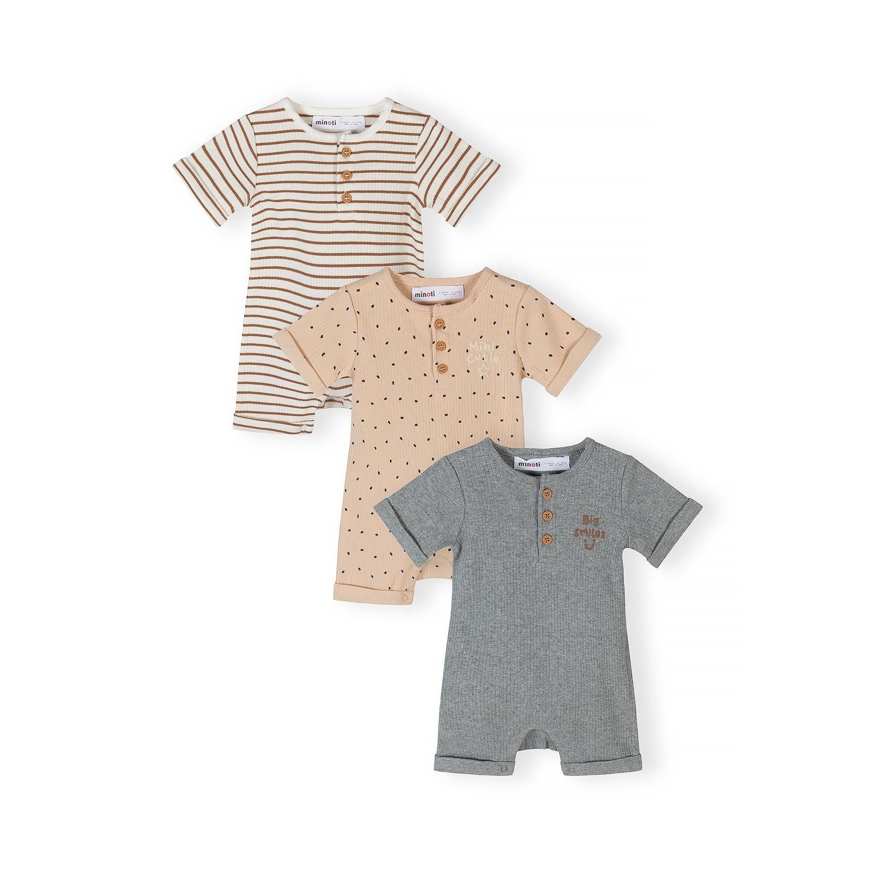 Three baby rompers arranged in a fan layout showing different patterns: cream with brown stripes, beige with small dots, and grey with text print