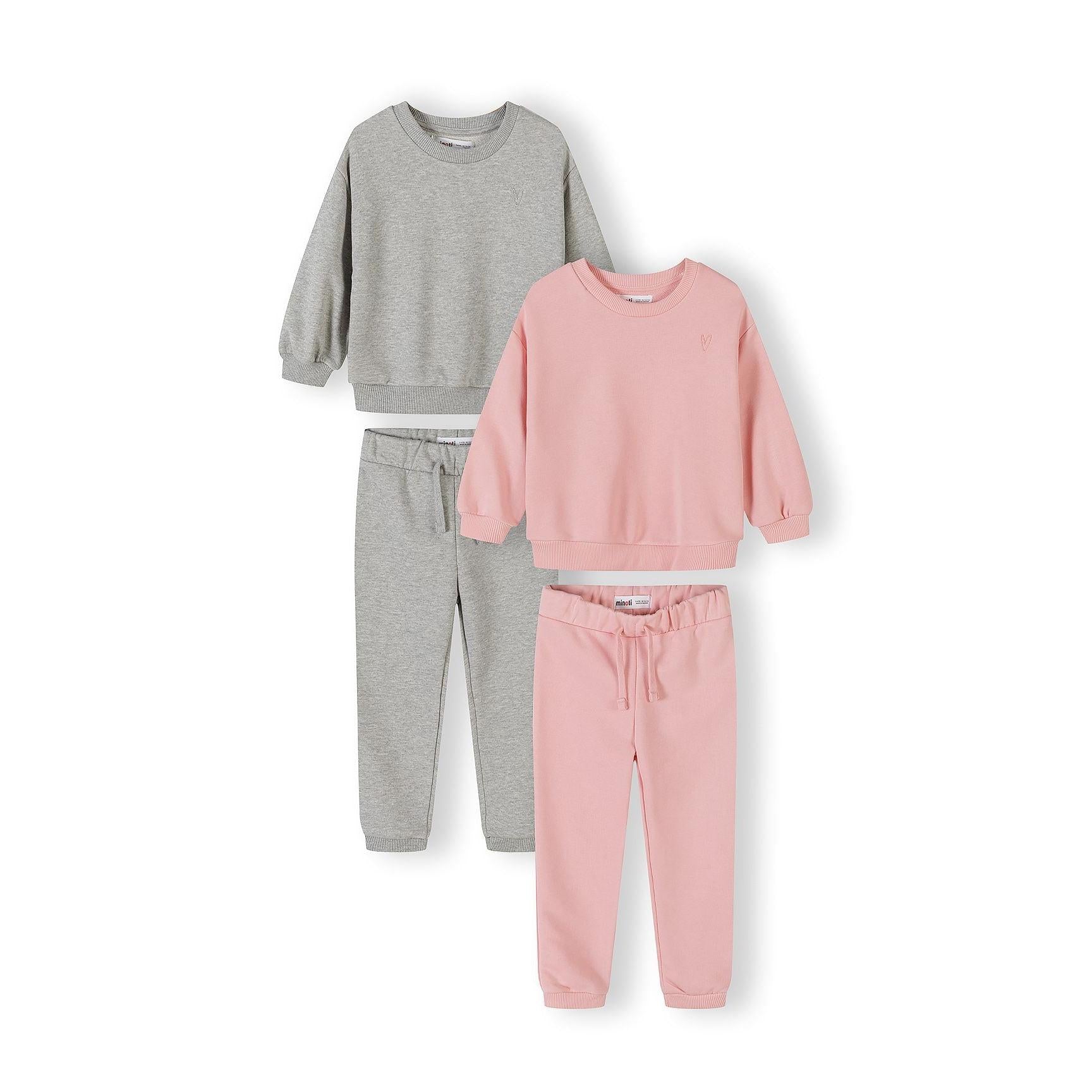 Four piece tracksuit set showing grey and pink sweatshirts with matching joggers laid flat on white background