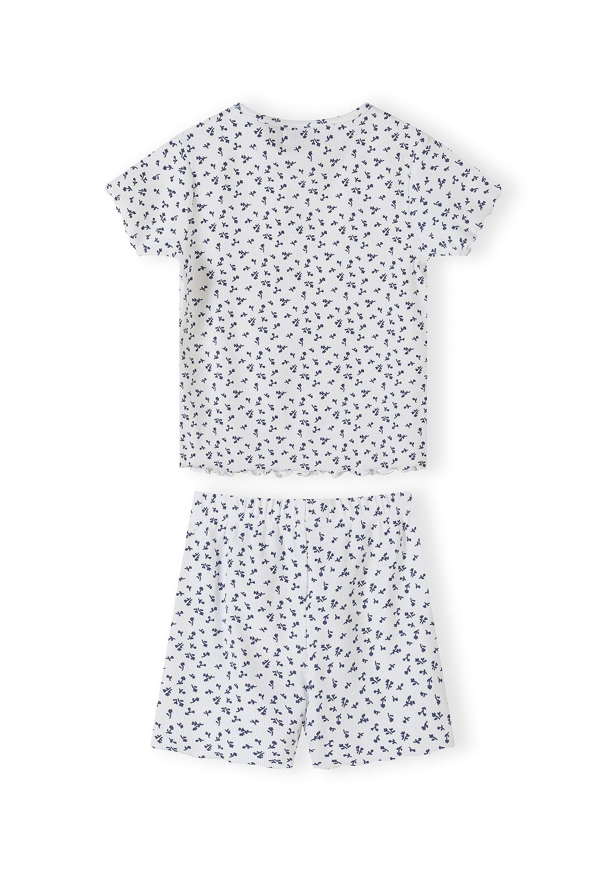 Close-up detail of white ribbed fabric with navy floral print pattern showing Minoti brand label