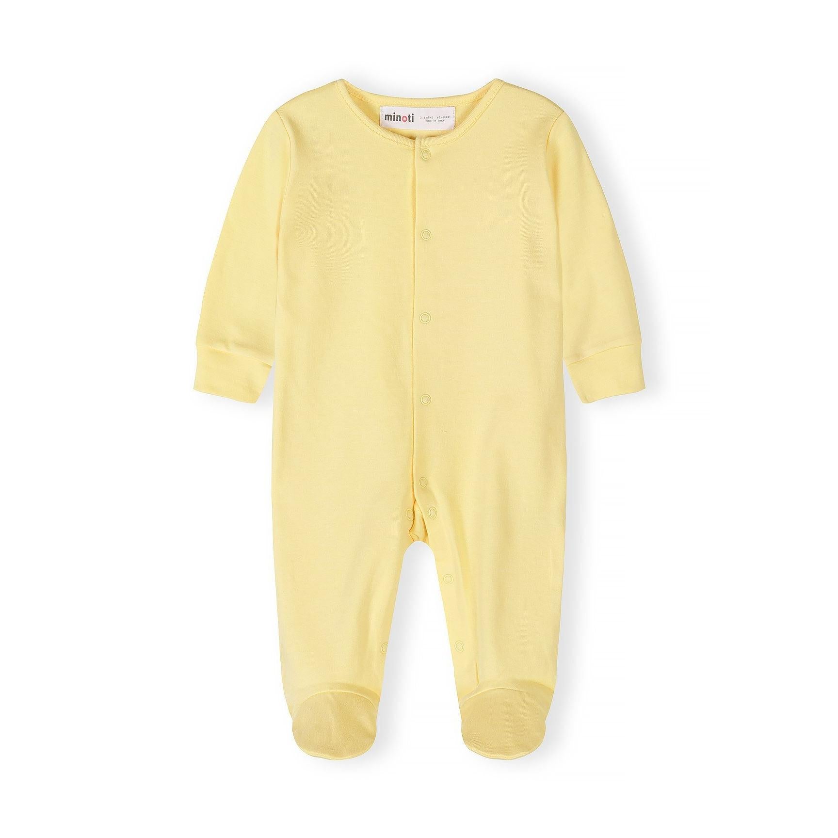 Single yellow baby sleepsuit laid flat showing front view with Minoti label visible at neckline and snap button closures down the front on white background