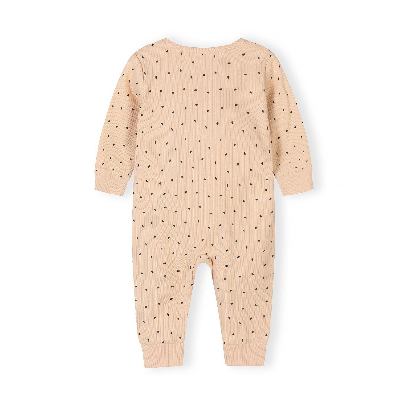 Detail shot of beige polka dot romper showing Mini Cutie text embroidery and black dot pattern on rib knit fabric