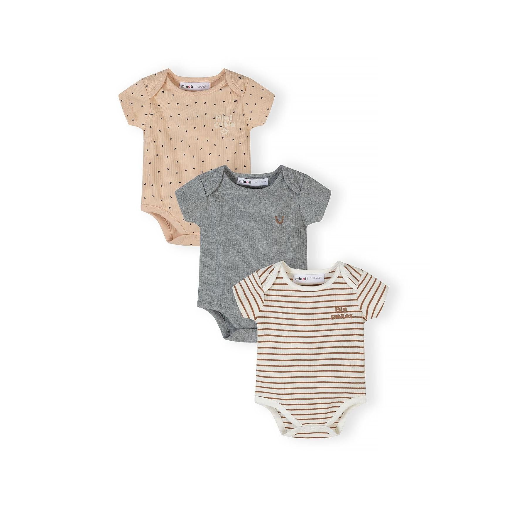 Three ribbed cotton bodysuits displayed on white background - beige with black polka dots, solid grey, and cream with brown stripes featuring 'big smiles' text