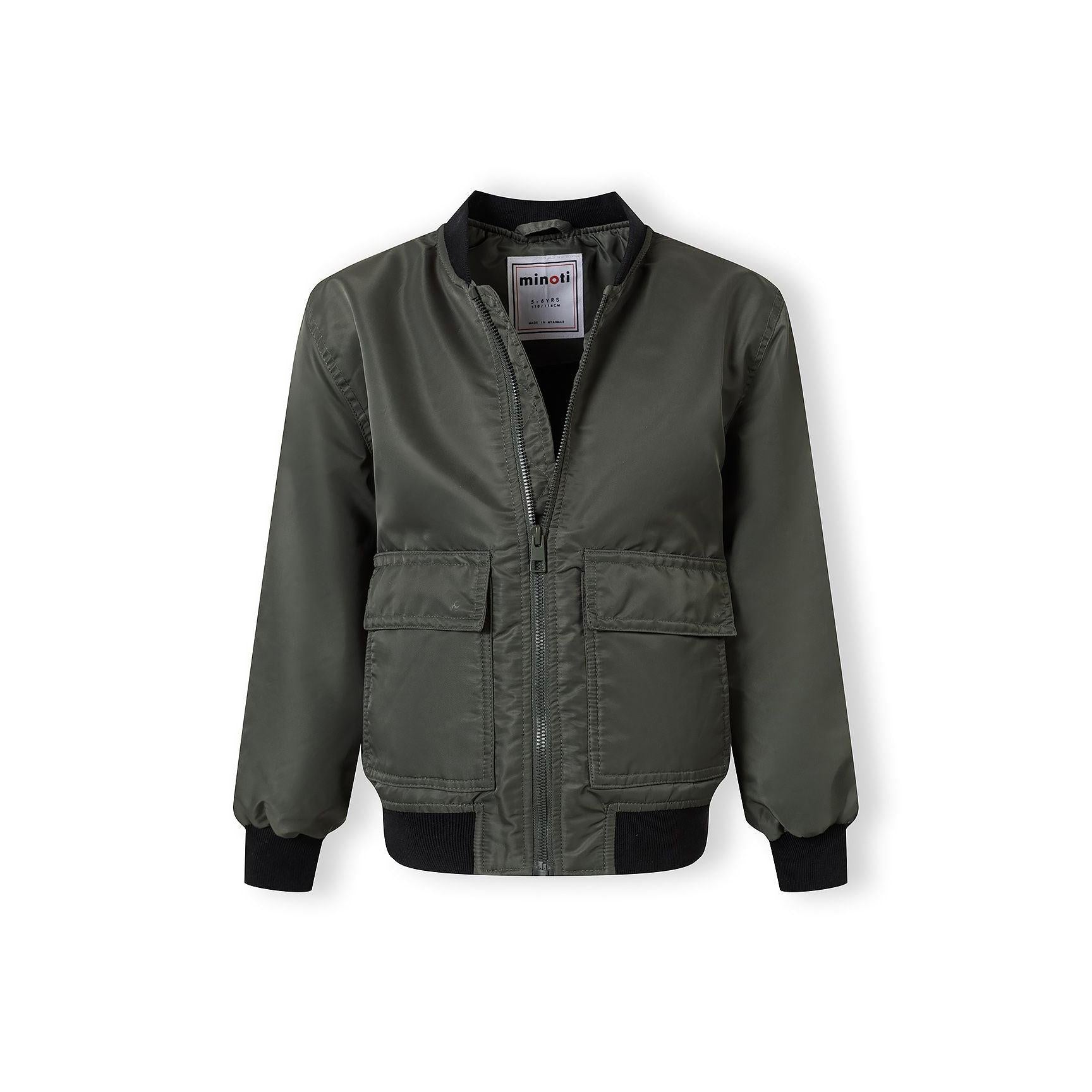 Front view of khaki bomber jacket showing zip closure and utility chest pockets with Minoti label visible at neck
