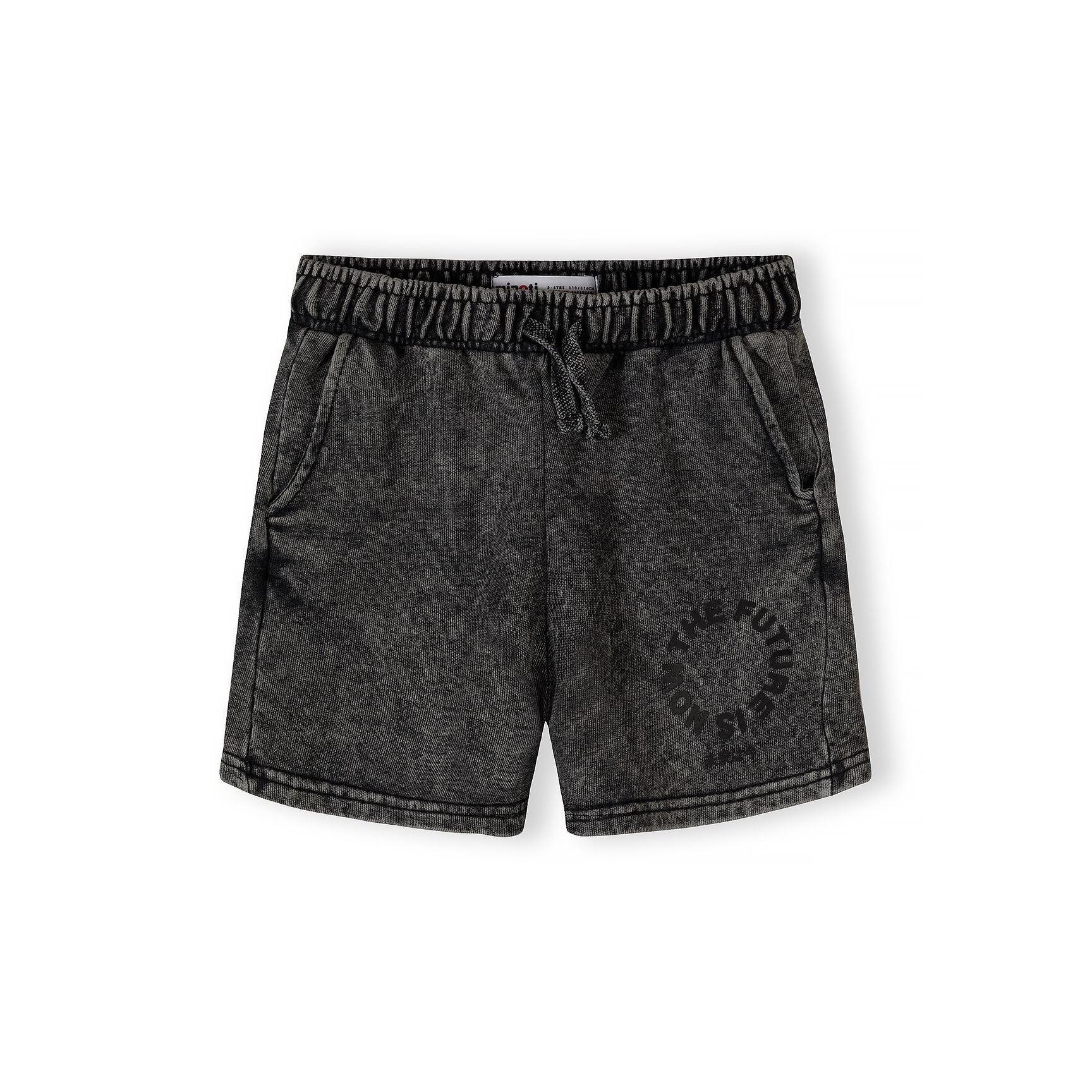 Close-up detail of grey acid wash fabric texture showing circular logo print and neckline construction