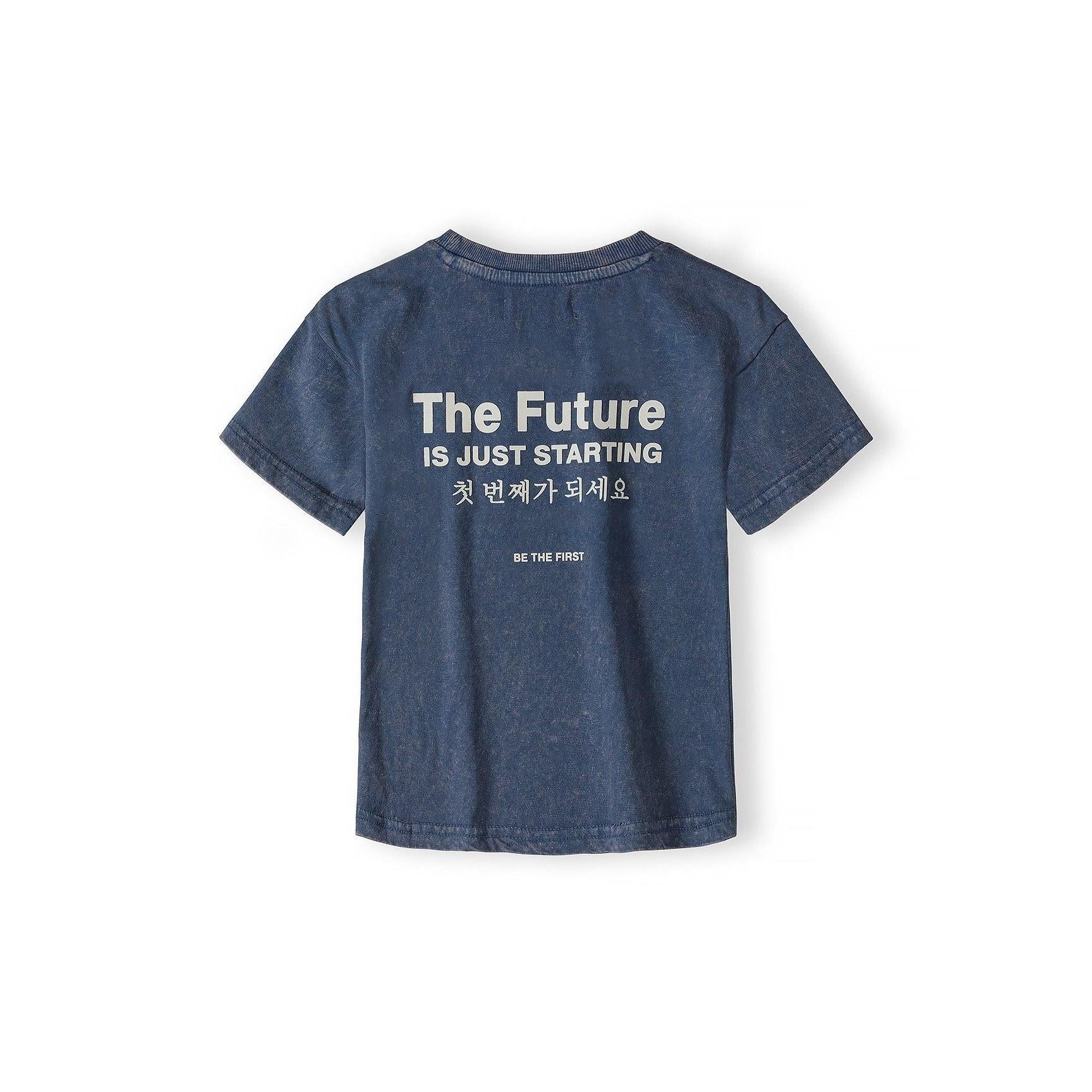 Back view of blue acid wash t-shirt laid flat showing 'The Future is Just Starting' text in English and Korean characters on white background