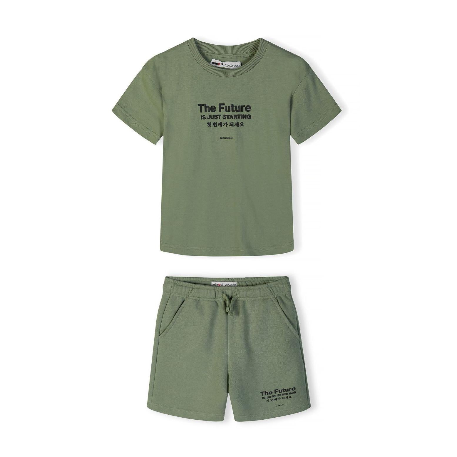 Flat lay of olive green shorts with drawstring waist and 'The Future Is Just Starting' print on leg, showing Minoti label on white background