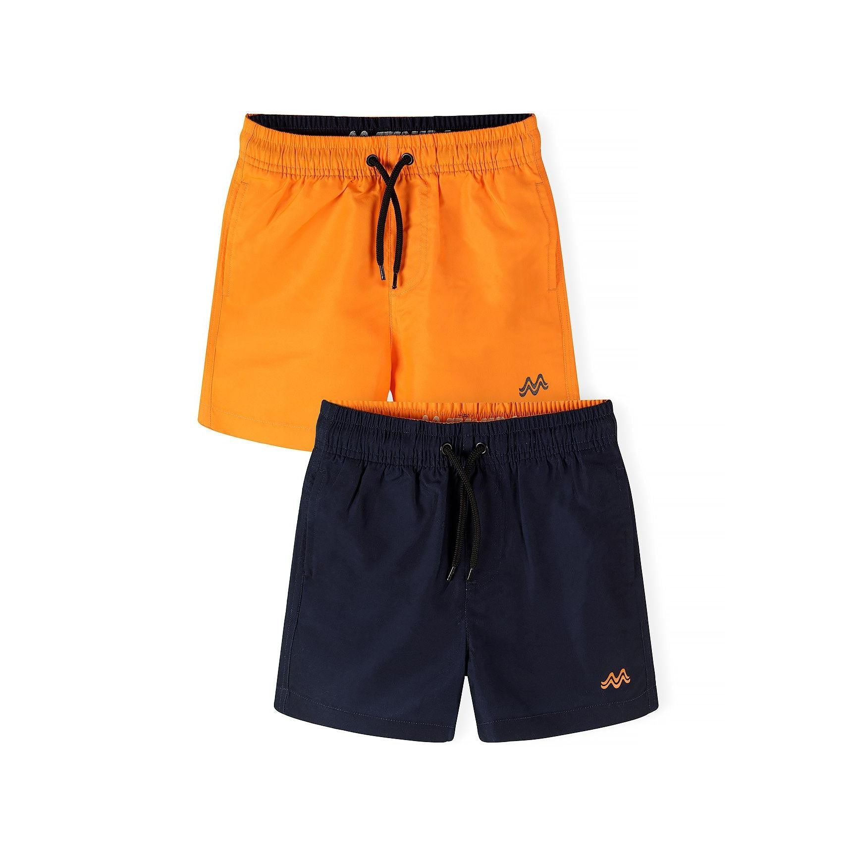 Two swim shorts laid flat showing navy and orange pairs with drawstring waists and small logo embroidery on white background