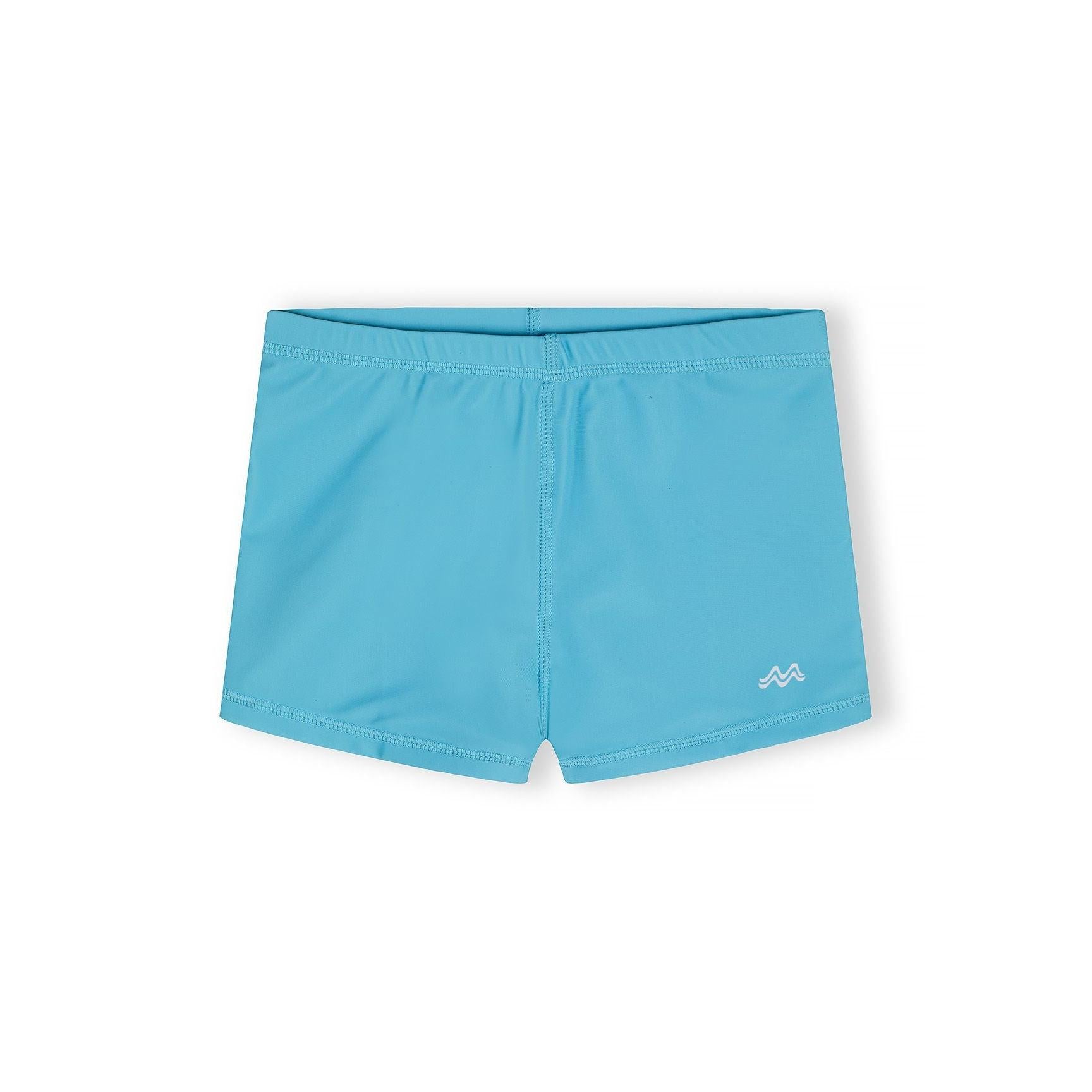 Single turquoise swim shorts laid flat showing elastic waistband and embroidered logo detail on white background