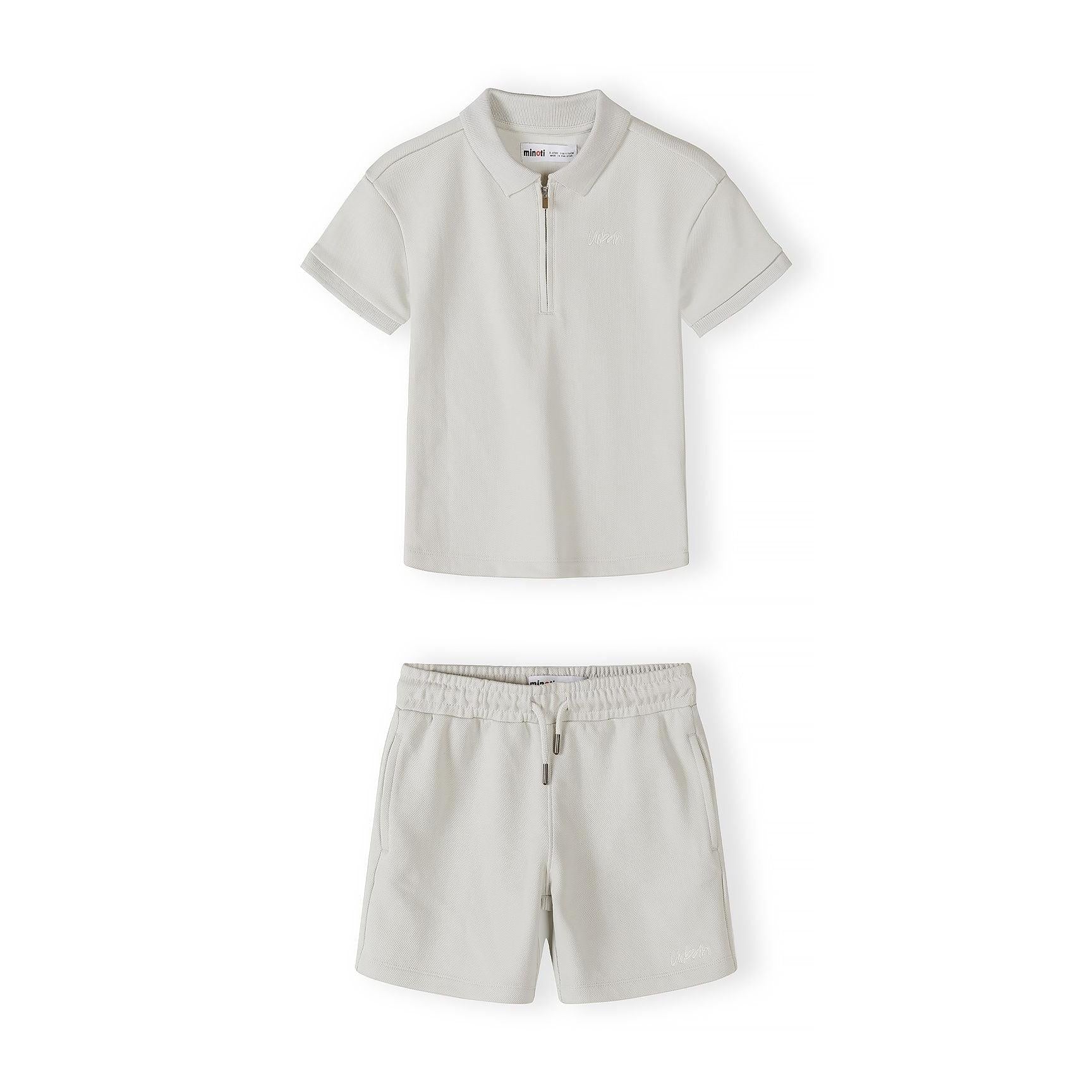 Back view of grey pique polo shirt laid flat showing textured fabric and ribbed collar construction on white background