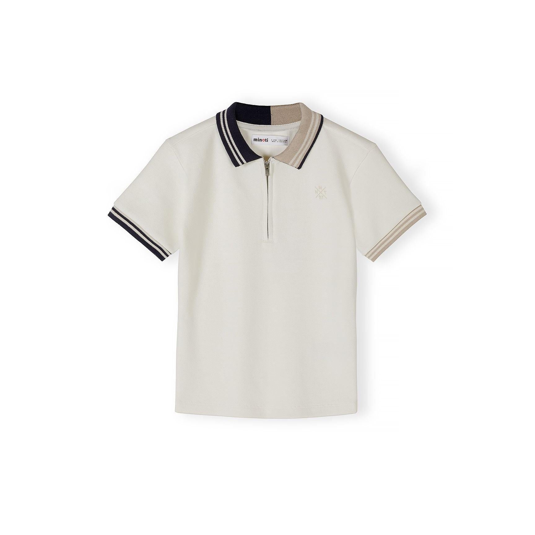 Close-up detail of cream pique polo shirt showing Minoti label, zip neck opening, navy collar and subtle embroidered logo on chest