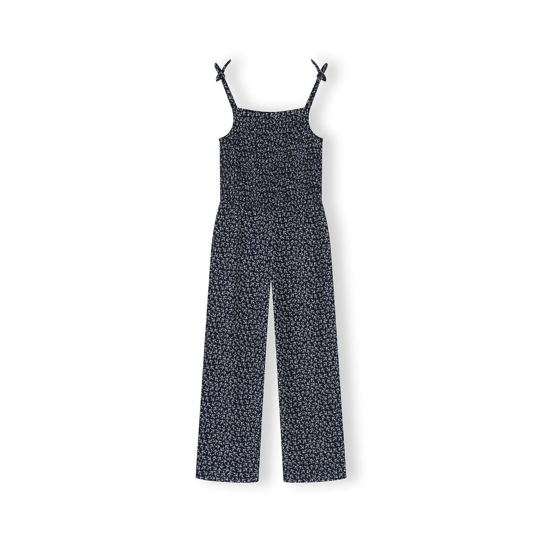 Navy floral jumpsuit laid flat on white background showing full garment construction with adjustable shoulder straps and smocked bodice detail