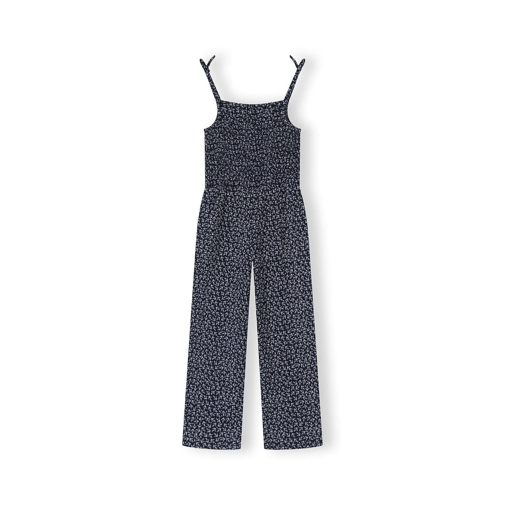 Navy floral jumpsuit laid flat on white background showing full garment construction with adjustable shoulder straps and smocked bodice detail