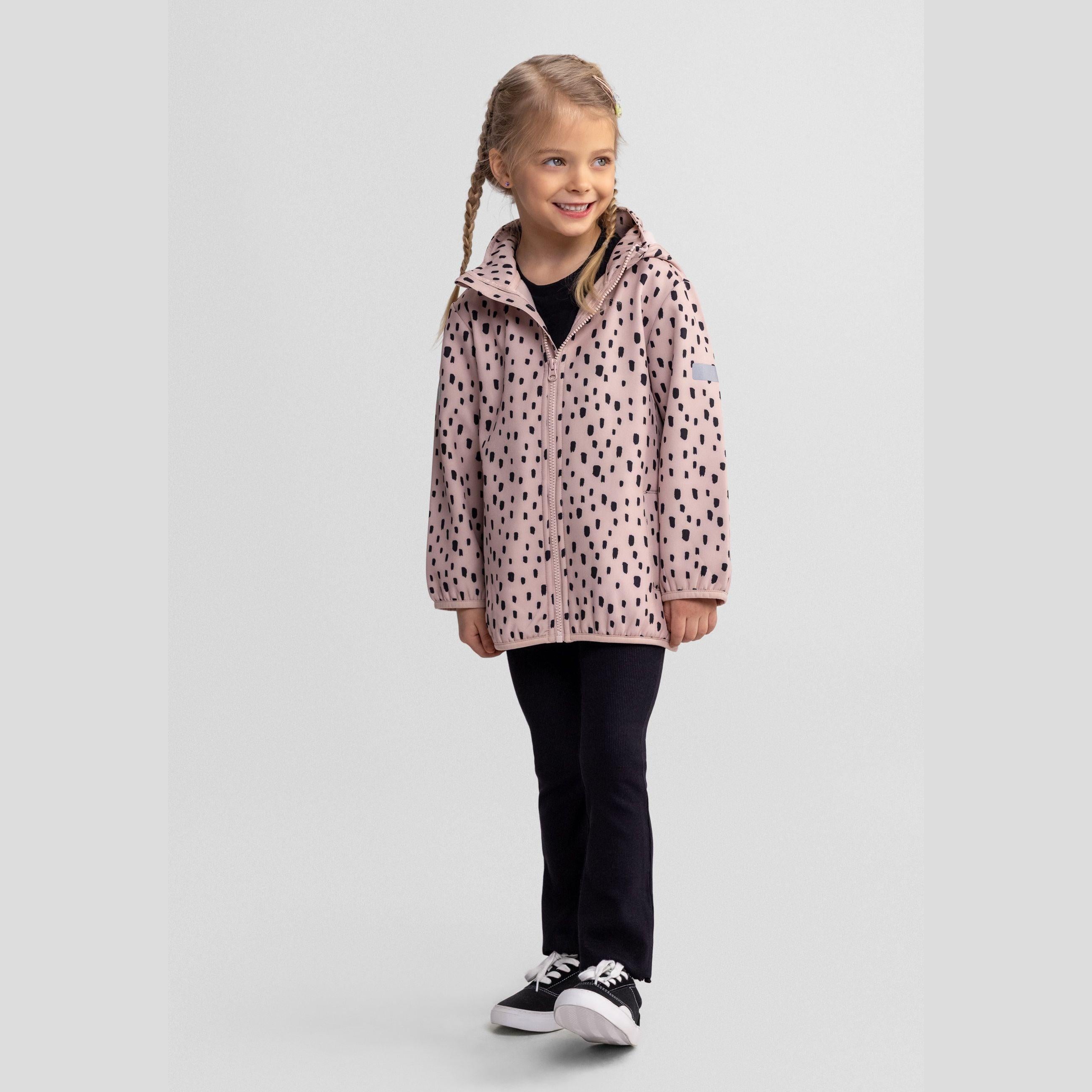 Pink softshell jacket with black spots laid flat showing removable hood, full-length zip closure and overall design details on white background