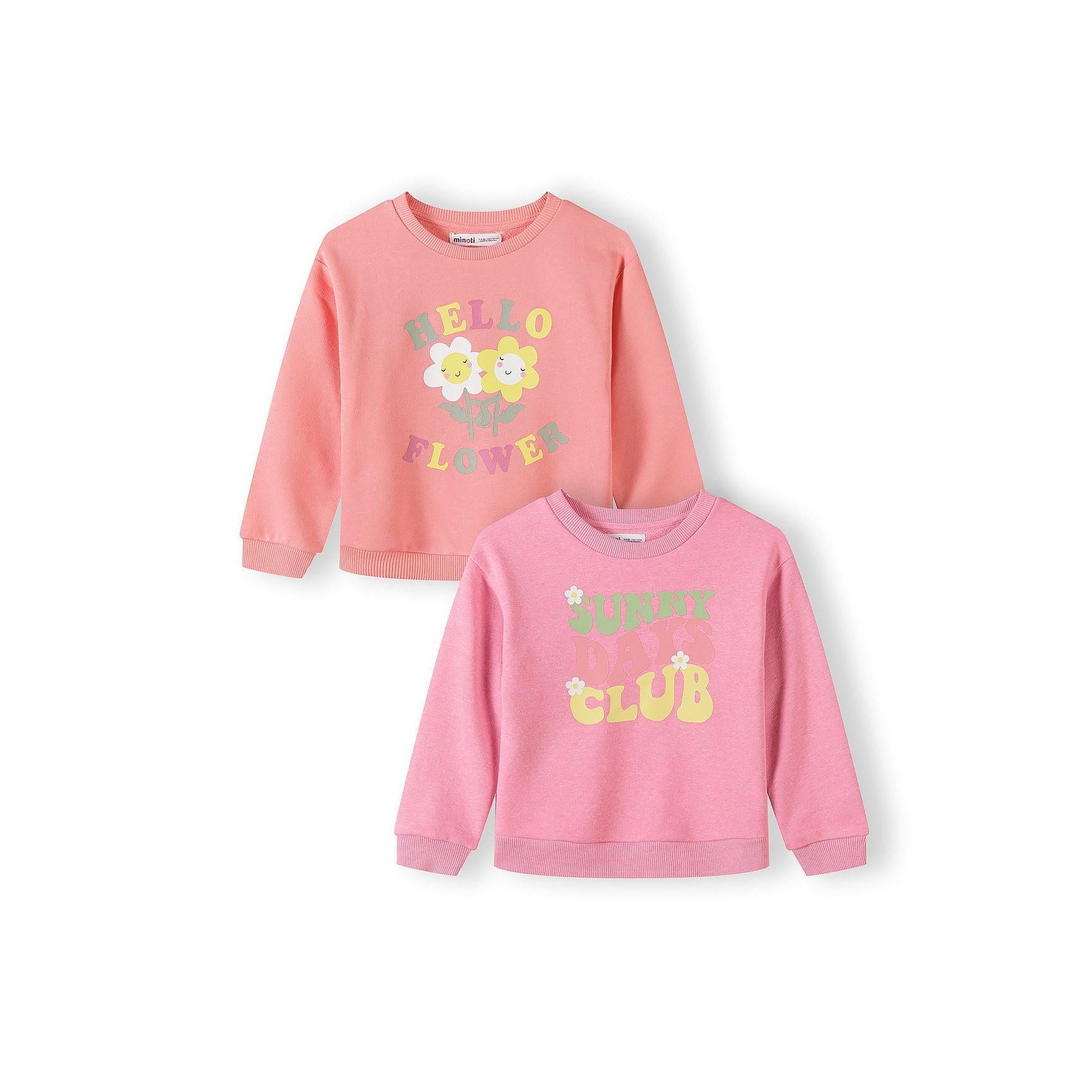 Two children's sweatshirts laid flat on white background - coral pink with Hello Flower text and smiling daisies, bright pink with Cutesy Club text