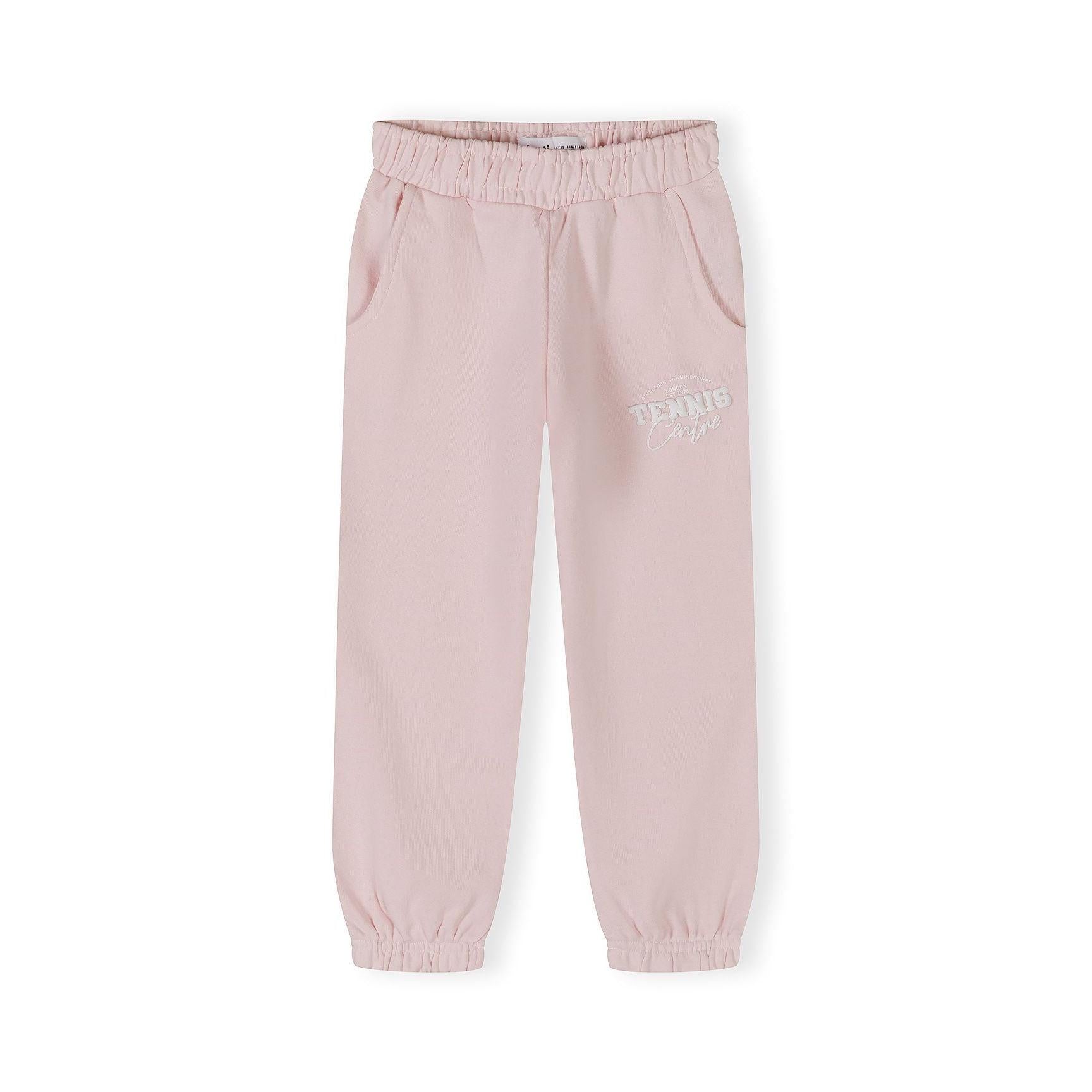 Close-up detail of light pink joggers showing elasticated waistband, side pocket and Tennis Camps print on leg