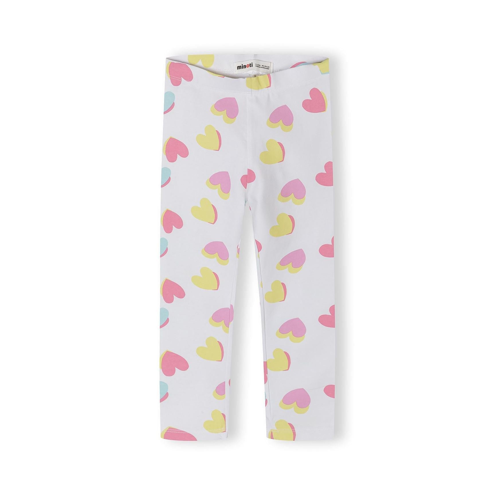 Close-up detail of pink leggings showing colorful heart print pattern with hearts in yellow, pink, purple and mint green colors