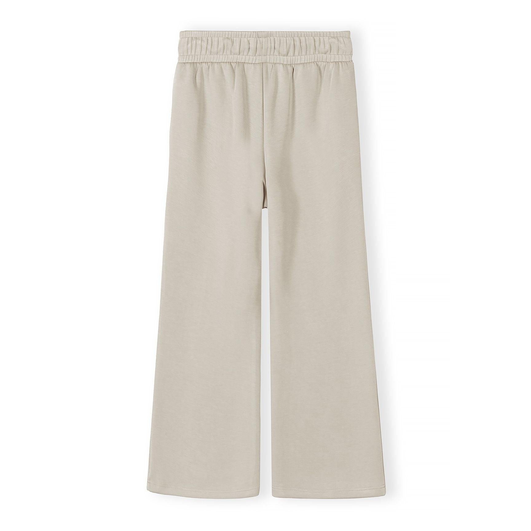 Close-up detail of beige joggers waistband showing Minoti label and adjustable drawstring ties with elastic waist