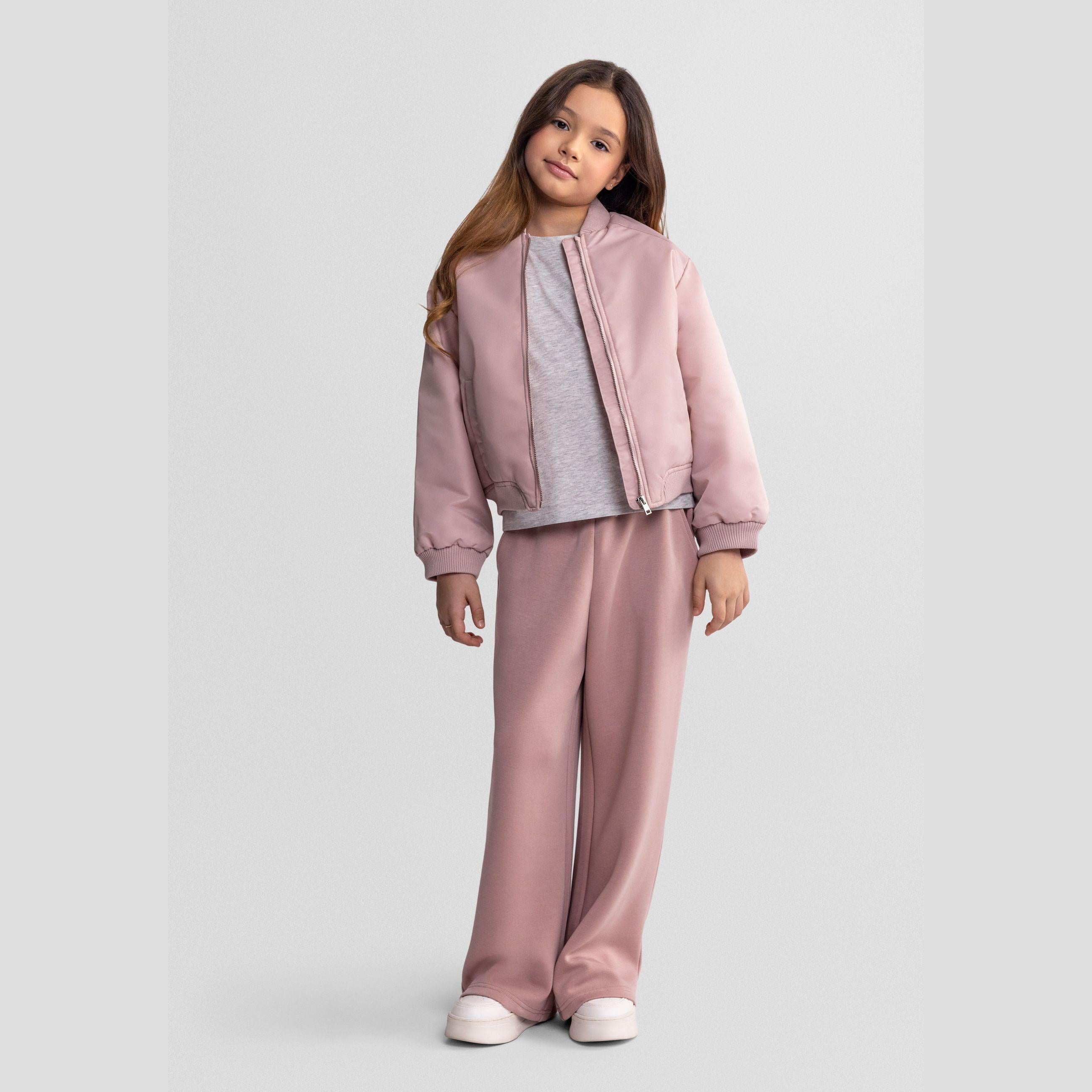 Pink wide leg joggers laid flat showing full length design with elasticated waistband and side pockets on white background