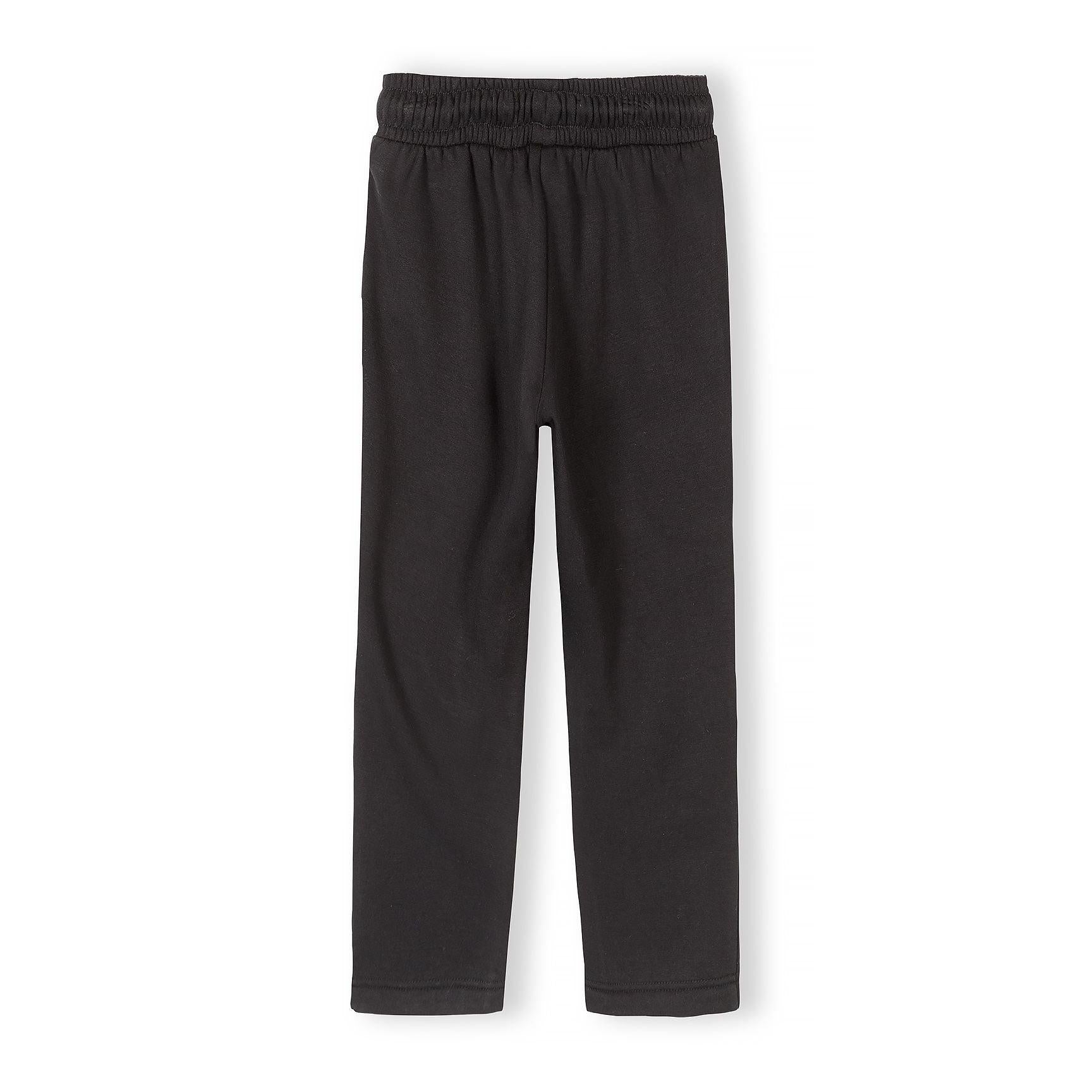 Black wide leg joggers laid flat on white background showing back view with elastic waistband and relaxed silhouette
