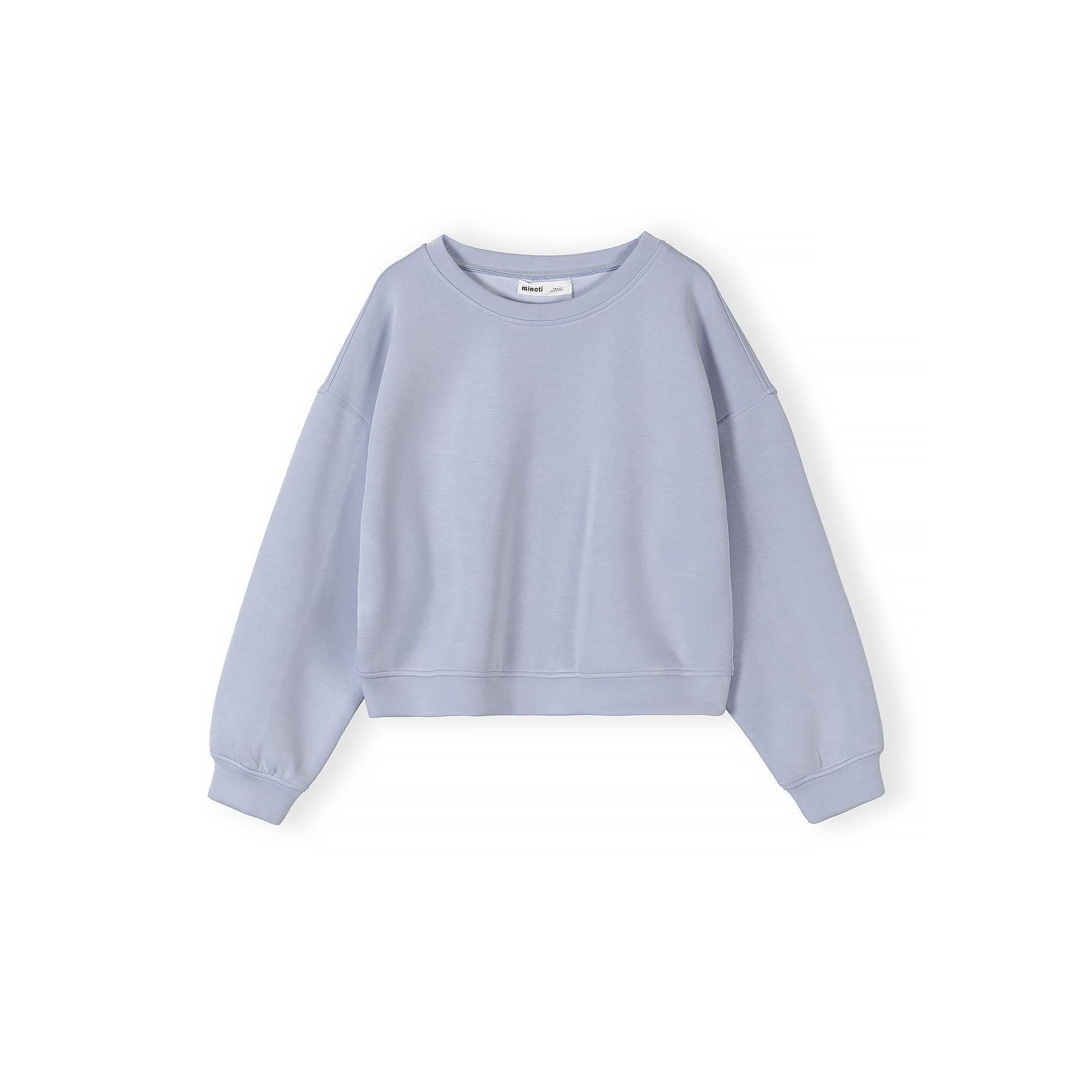 Close-up of lavender blue shorts with elastic waistband and drawstring detail on white background