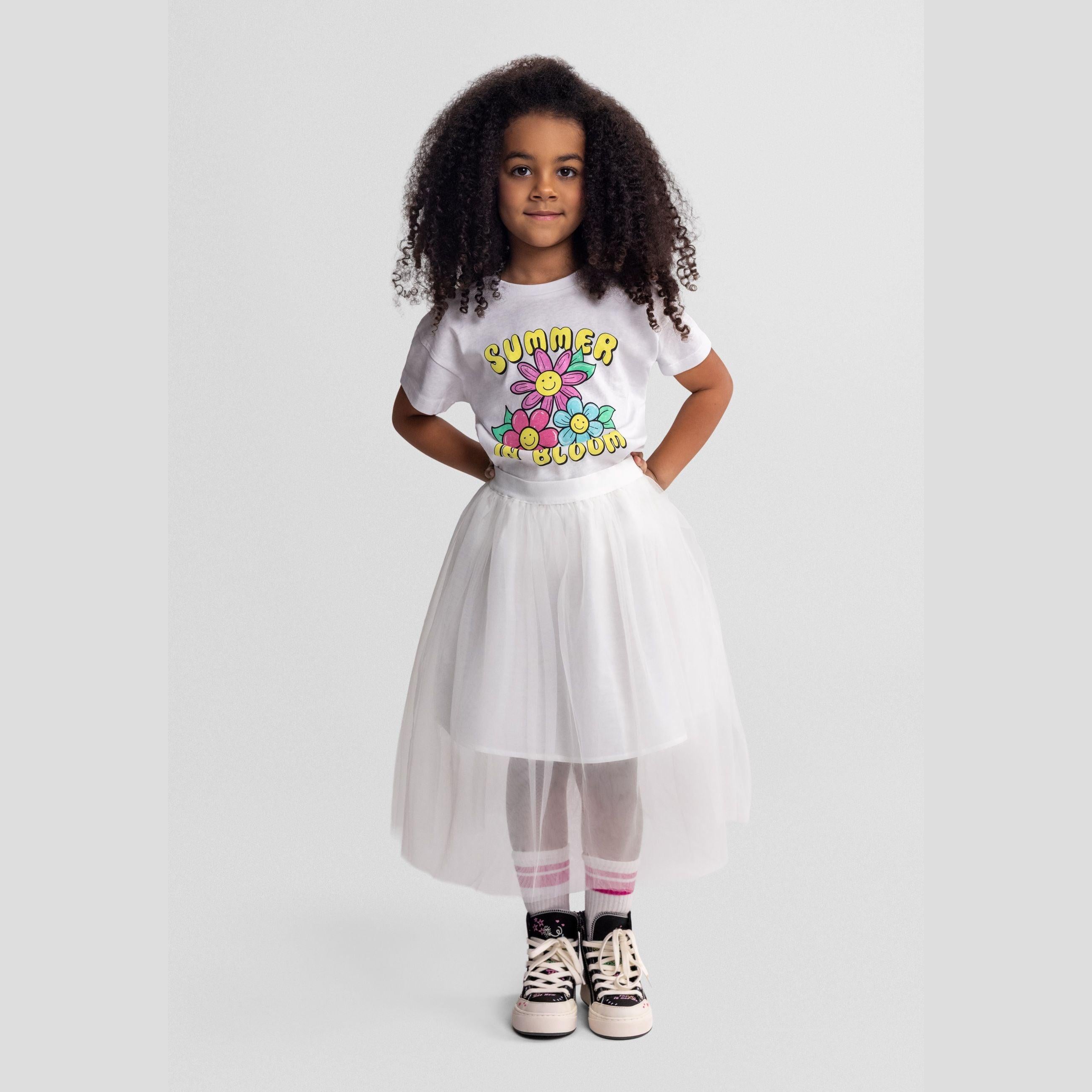 Off white pleated tulle maxi skirt displayed flat against white background, showing full length and multiple layers of fine pleating